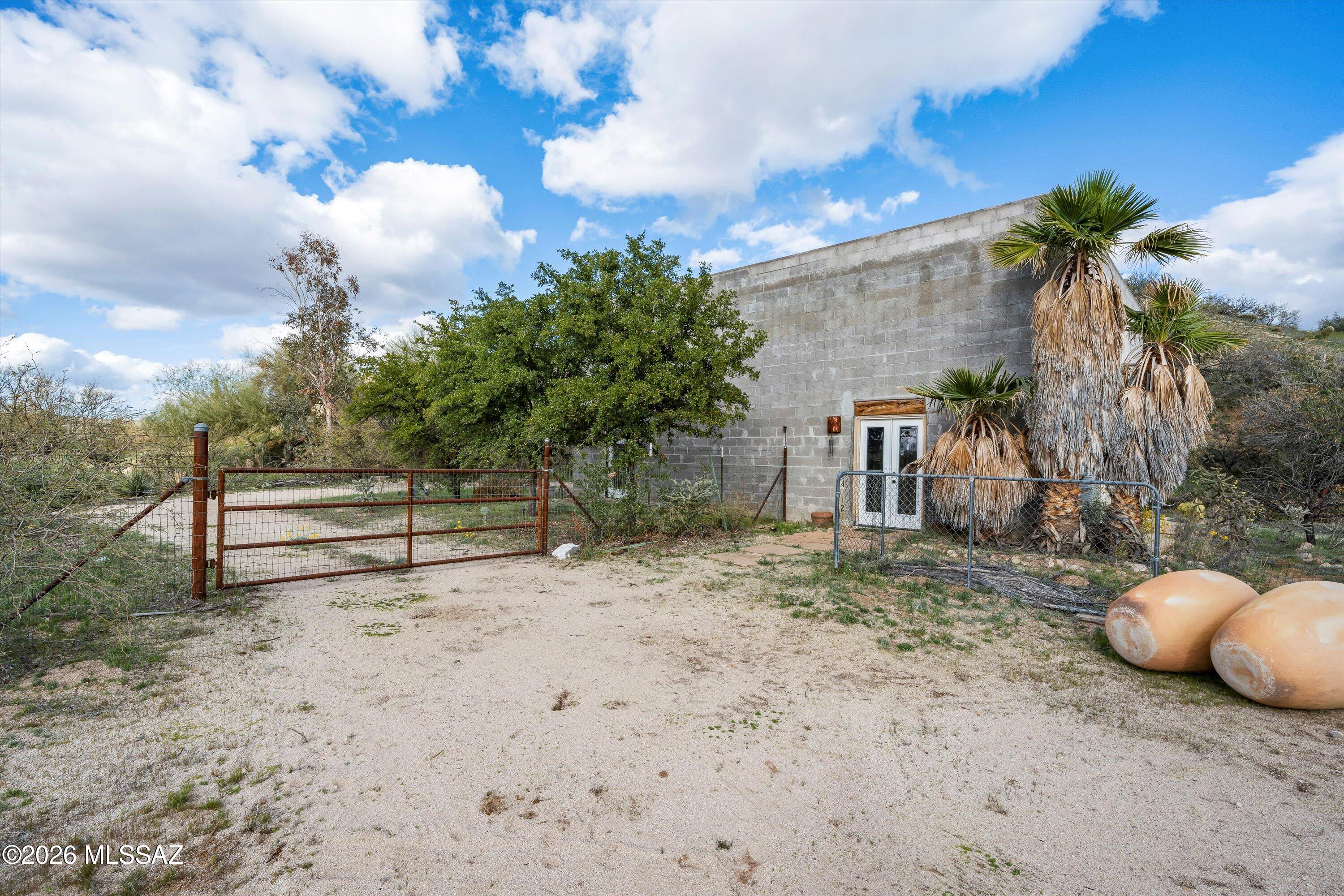 Home has a charming industrial feel, ready for your individual touch! Unique and private 1 bedroom, 1 bath home on private road in Catalina.  This 1.25 acre property is surrounded by natural desert and offers extensive views. The living areas are open with high ceilings, fans and skylights.  A bonus loft offers more living space or a spot for your creative side.
