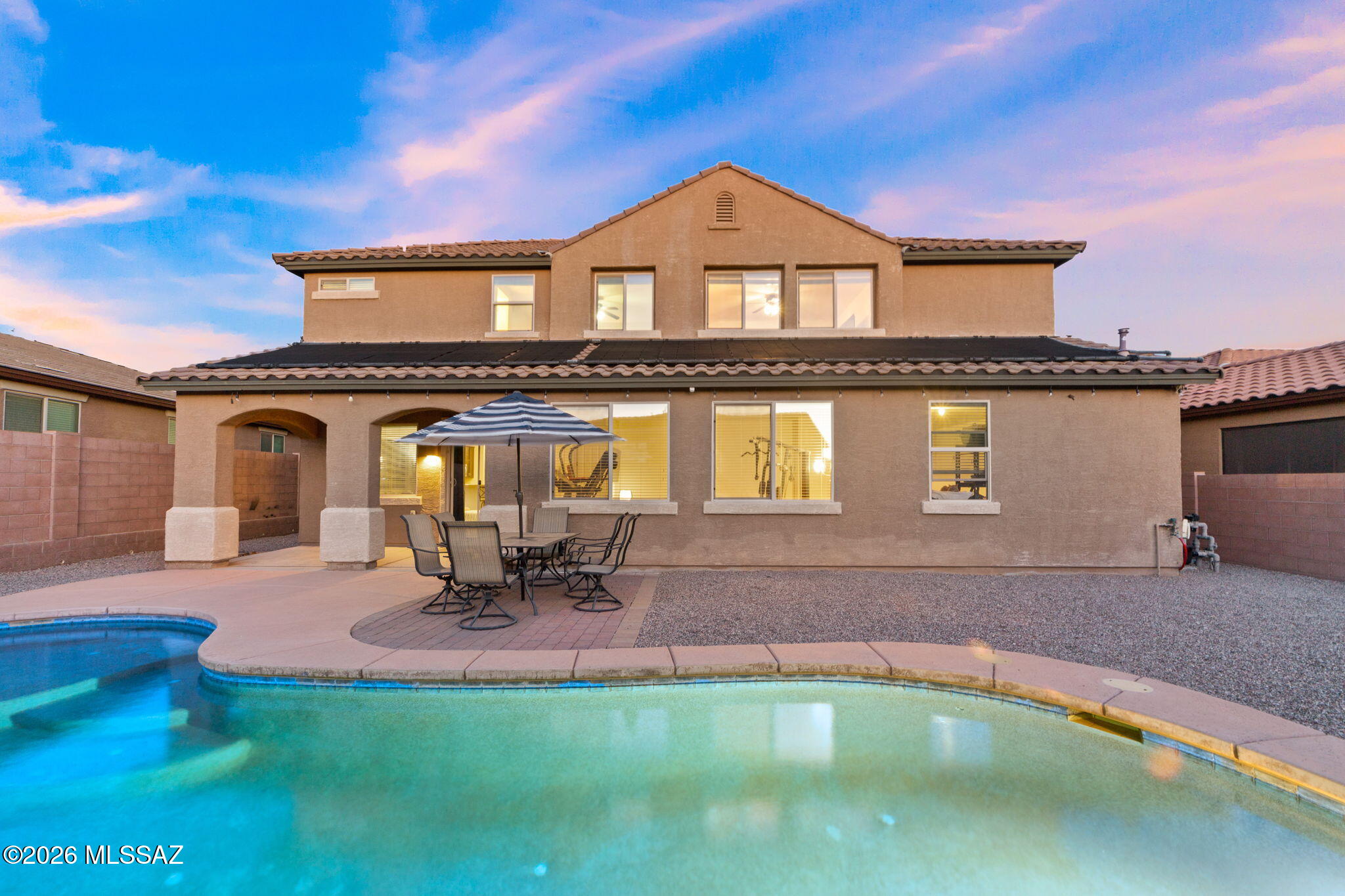 Welcome to the best value in the luxury gated community of Tangerine Crossing! Meticulously maintained. The 5bed-4bath layout features a rare main level bedroom & full bath, ideal for multi-generational living or long-term guests, plus another room for a home office or TV/game room. 
The open main floor features a chef's kitchen flowing into a spacious living area, from here step outside to a covered patio and a sparkling heated pool to enjoy all year round! The upstairs offers a loft area & a premier primary suite with a spa-like bath & huge walk-in closet. Complete all this with the 3 car garage & the premium shopping and dinning just min away. Schedule your tour TODAY!