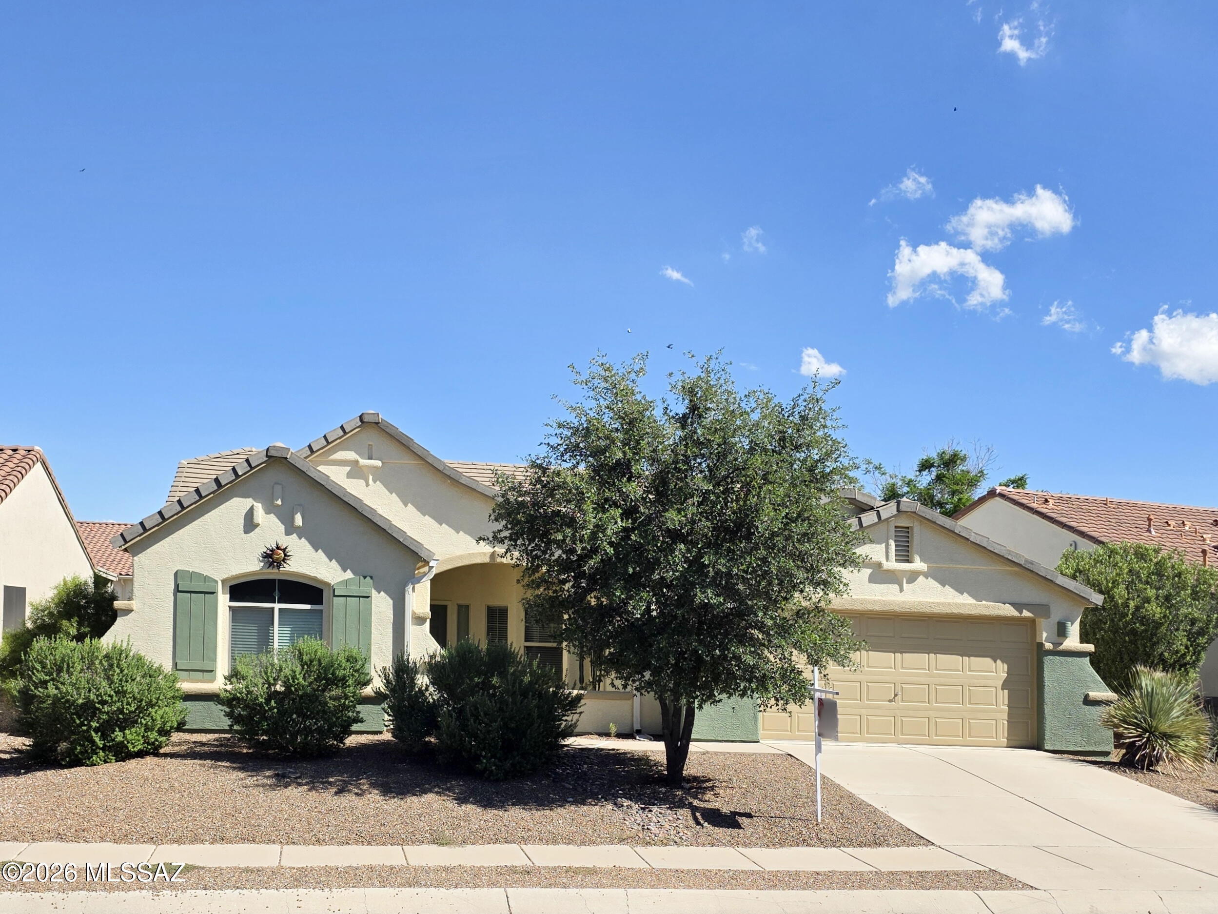 Bright, open concept living in a friendly community located at the foothills of the Tucson Mountains. This low-maintenance home has a large backyard, split floor plan, and spacious Master suite with vaulted ceilings and walk-in closet. The kitchen has granite counters, a large island for cooking and entertaining, and a gas stove. Nearby recreational opportunities include a bike loop, 2 pool facilities, a park, a baseball field, soccer field, and tennis. It is also close to nature, shopping, and the freeway. The exterior was painted in 2025 and the HVAC is about 4 years old. Solar Electric system and existing 210 home warranty will transfer at closing to buyer(s).