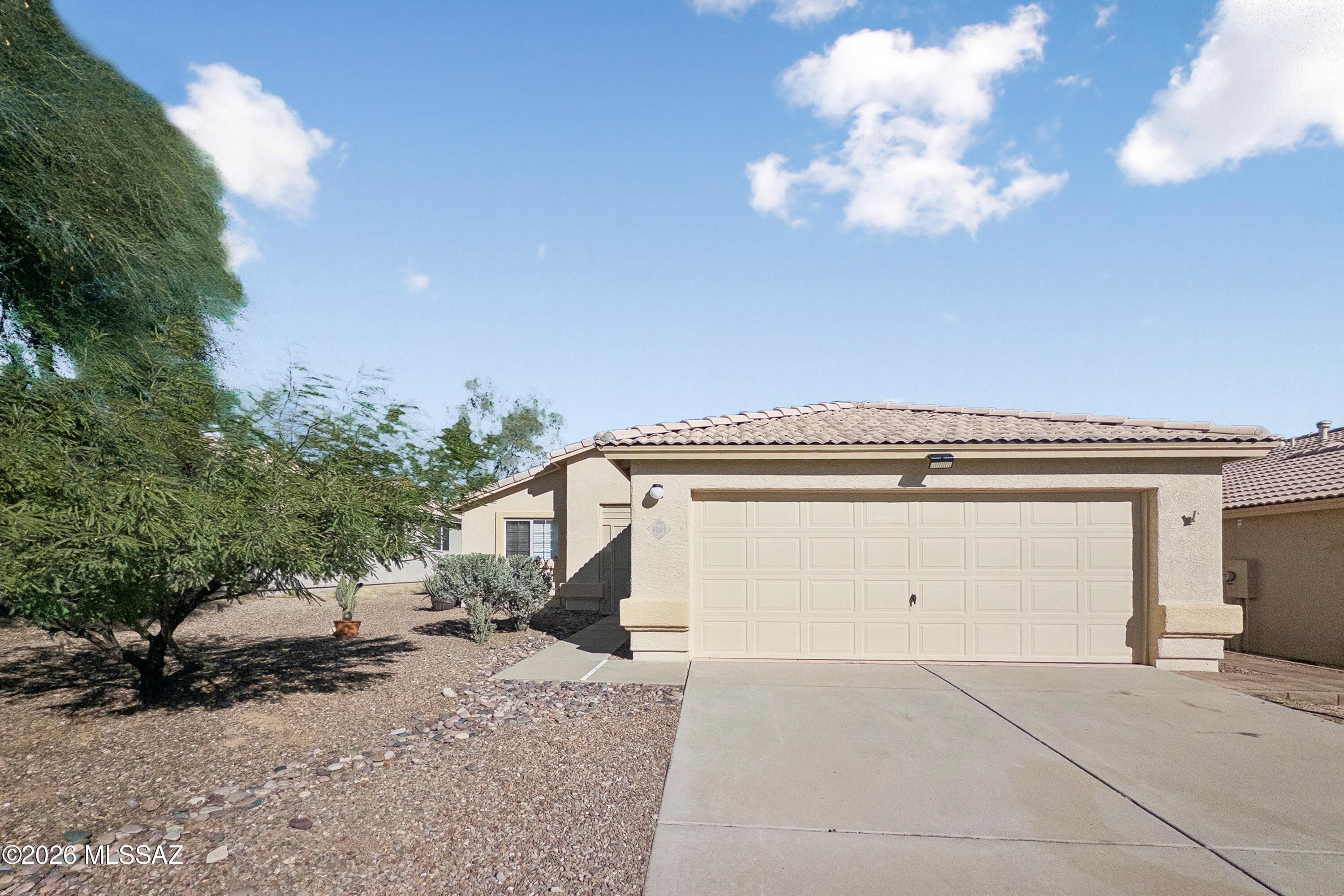 Welcome to 8082 N Wild Aster Way in the desirable Suncrest neighborhood! This inviting single-story home offers 1,308 sq. ft., a spacious great-room layout, and a 2-car garage. Enjoy fresh updates throughout, including new light fixtures, freshly painted kitchen cabinets, quartz countertops, new cabinet pulls, a new kitchen sink and faucet, updated bathroom countertops and faucets, new toilets, and fresh exterior paint. With a tile roof, refrigeration cooling, and forced-air heating, this home offers comfort and style. Conveniently located near shopping, dining, schools, and everyday amenities, it's a wonderful place to call home or an excellent investment opportunity. Come see it for yourself!