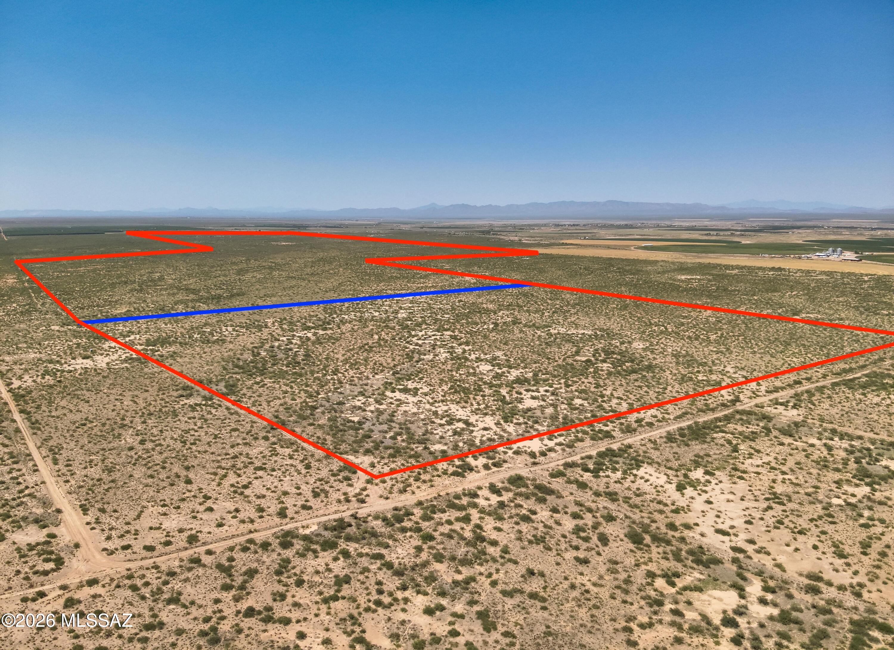 Discover a rare opportunity to own over 802 acres of versatile RU-4 zoned land in the wide-open landscapes of Elfrida, Arizona. Whether you're envisioning a working farm, ranch, or a private desert retreat, this expansive property offers the flexibility to bring your vision to life. The land includes two parcels totaling 802.04 acres (160.82 acres and 641.26 acres) and is already improved with two domestic wells and three irrigation wells (buyer to verify depth and water availability), providing a strong foundation for potential agriculture or livestock use. Take in sweeping views of the Swisshelm Mountains to the east and enjoy breathtaking Arizona sunsets stretching across the western horizon. A 2018 survey is available for added peace of mind. With its size, zoning, and existing infrastructure, this property presents a unique opportunity in Southern Arizona's rural market--and may qualify for USDA financing.