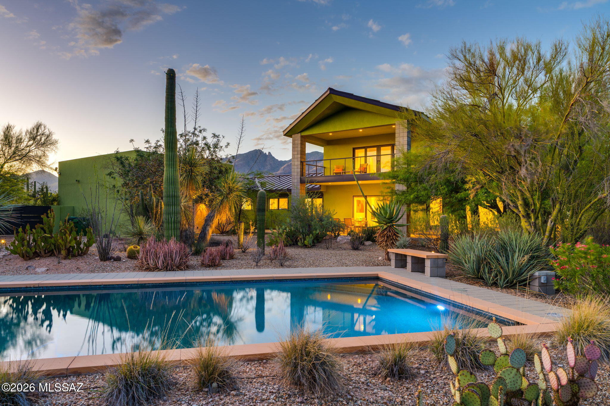 A rare opportunity to own one of the Catalina Foothills' most distinctive custom homes. Extensively remodeled and expanded, this exceptional residence blends European-inspired design with outstanding craftsmanship and meticulous attention to detail. Walls of glass frame mountains, city, sunset, and desert views, filling the home with natural light while creating a seamless connection to the surrounding landscape. The spacious entertainer's kitchen opens to inviting living spaces, while the loft and balcony provide additional flexibility. Enjoy total privacy, a Pebble Tec pool, no HOA, and breathtaking desert landscaping from nearly every room. Located near shopping, dining, hiking and Catalina Foothills High School. A home with character & personality that must be experienced in person.