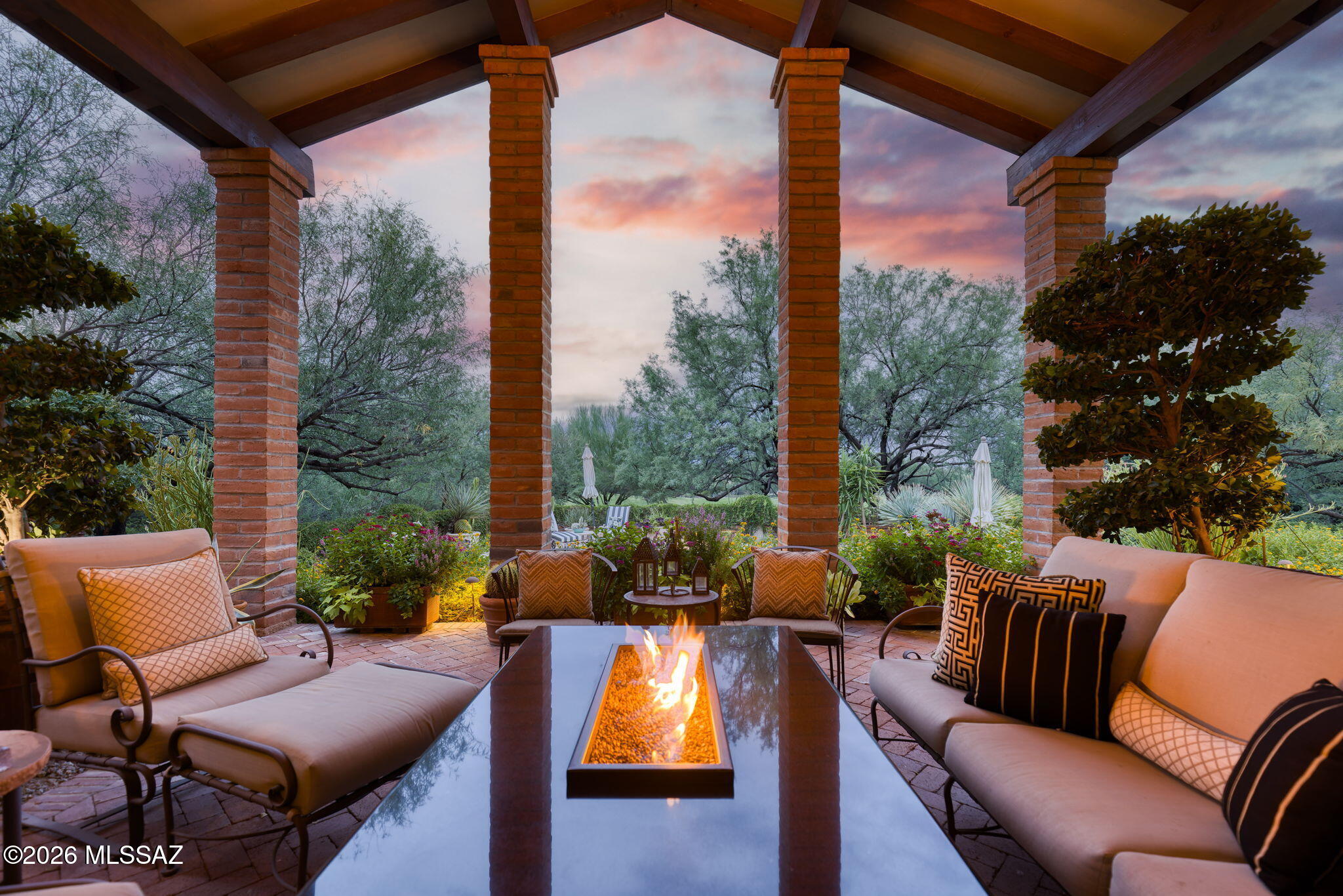 Architectural Masterpiece on the Golf Course in Guard Gated Ventana Canyon. One-of-a-Kind 4BR & 3BA 4,335 SqFt Slump Block Home Features a Lush Courtyard Entry w/ Wood-Beamed Ceilings that Gracefully Flow Through the Home and Seamlessly Extend to the Back Patio, Creating a Blend of Indoor & Outdoor Living. Fine Features Include:Gourmet Island Kitchen w/ Sub-Zero Ref, Gas Range, Double Oven, Prep Sink, & Breakfast Nook - Family Room w/Grand Stone Fireplace, Built In Book Case,& Wet Bar - Expansive Primary Suite & Luxurious Bath w/Separate Garden Tub & Shower, & 3 Walk-in Closets - Exquisite Outdoor Living Spaces w/ Impeccable Landscaping, Multiple Seating & Dining Areas, Fireplace, Grill & Bar Area + Sparkling Pool, and Private Hot Tub. Circular Brick Driveway w/ 3 Car Garage. Showstopper!