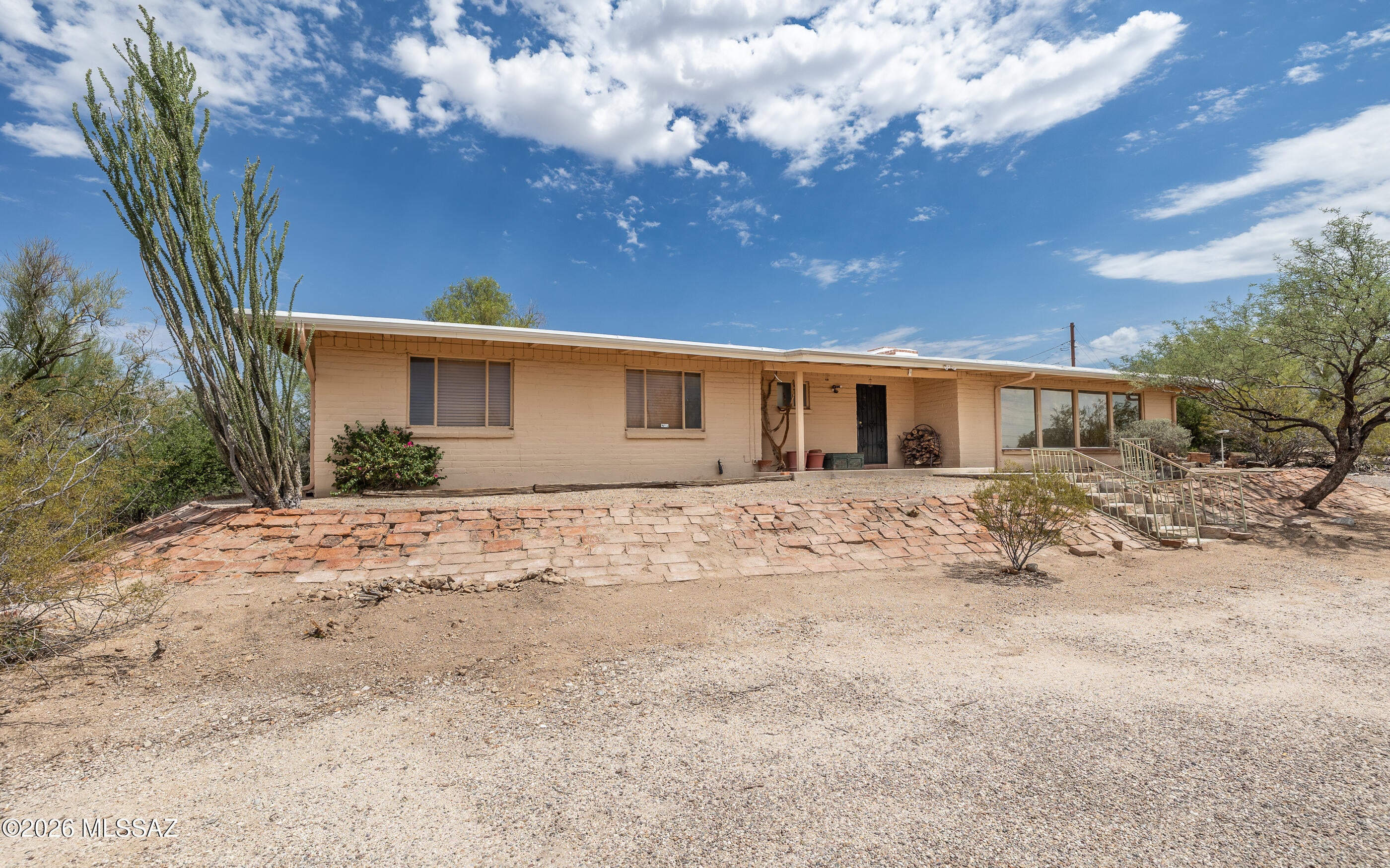 Bring your vision to this rare Catalina Foothills Opportunity! Situated on 1.82 acres with stunning mountain views!  This spacious single-story home offers 3,483 sq. ft., 3 bedrooms + guest quarters with private entrance, 3 bathrooms, a large swimming pool, and NO HOA.  This property presents an exceptional opportunity to create your dream home in one of Tucson's most desirable locations. The kitchen was remodeled in 2021, and the roof was replaced in 2021, providing an excellent starting point for buyers looking to update and make this home their own. The flexible floor plan is ideal for multigenerational living, extended guests, a home office, or potential rental income.  Enjoy the privacy of acreage living, plus convenience,  while being just minutes from Catalina State Park, L Encantada, restaurants, golf, Sabino Canyon, and some of Tucson's best hiking trails.  Whether you're searching for a Catalina Foothills home, a pool home, investment opportunity, or a property with incredible potential in a prime location, this is a rare chance to create your dream home in one of Tucson's most desirable neighborhood.  Property is being sold AS IS.  Don't miss this opportunity!
