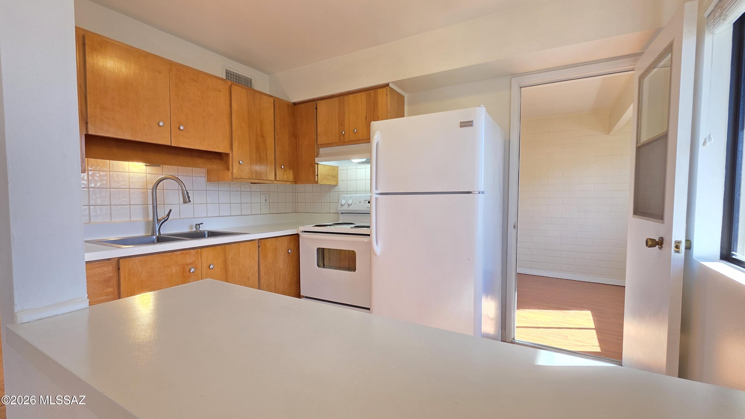 Charming, well-maintained 1-bedroom, 1-bathroom second-floor condominium. This home features original hardwood cabinetry, ample closet space, and a versatile enclosed patio room that offers the perfect space for a home office, reading area, or relaxing sunroom.

Enjoy a private setting with plenty of beautifully maintained green space throughout the property. Residents have access to a refreshing pool, relaxing hot tub, recreation area, comunity room and clean on-site laundry facilities. 

Cash only. No rentals permitted.
Listing agent is related to Seller.