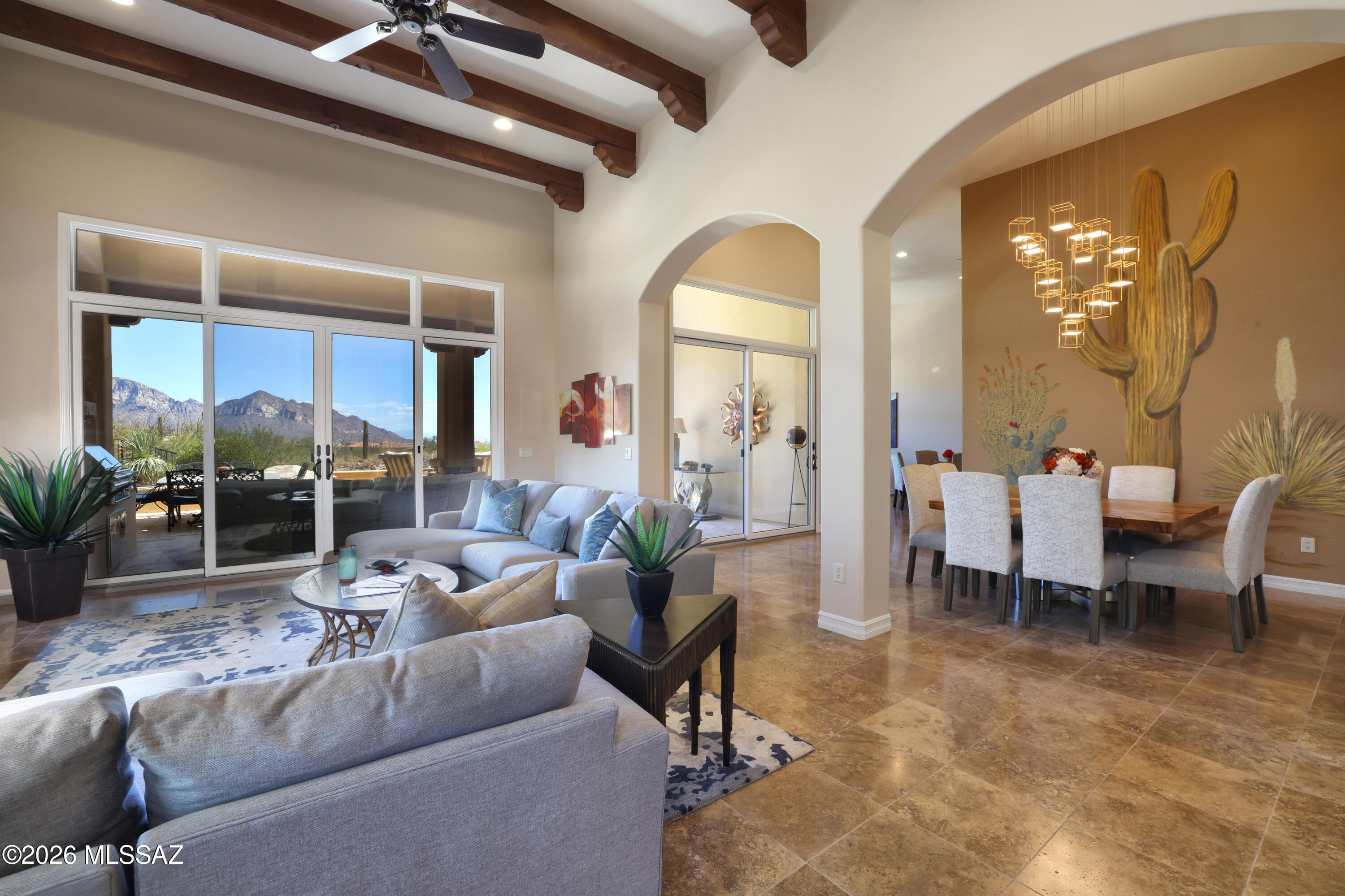 Panoramic views of majestic Catalina Mtns over open space, charming Tuscan design, quality construction, spacious relaxation-oriented patio with spool and firepit, fabulous interior (furnished!), bright open layout, luxury amenities, AND 3-car garage w/AC! You can enjoy it all with this gorgeous ~3,200 SF 3BR/4BA Stonegate Tuscan retreat in exclusive guard-gated Stone Canyon golf community in prestigious Rancho Vistoso area of Oro Valley. High ceilings (real wood beams), Travertine floors, stone-faced fireplaces, new bar area w/wine ref, great kitchen (drawers, under-cab lighting, granite ctrs, drinks ref, gas cooktop w/hood, newer SS appls), lovely primary plus 2 guest suites. Lots of glass showcases marvelous views from raised site of this furnished home. Club Membership Req'd. OPEN 6/14