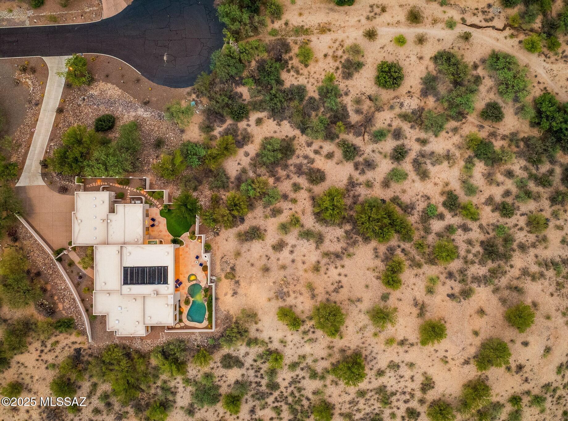 **Rare opportunity** to own a premier homesite in the gated Palisades Point community, showcasing sweeping, unobstructed views of iconic Pusch Ridge in the Santa Catalina Mountains. This exceptional parcel offers the perfect canvas to design a custom, single-story dream home in the heart of Oro Valley, where dramatic mountain scenery takes center stage. HOA guidelines require a minimum residence of 2,500 square feet and maintain the community's single-level architectural integrity.