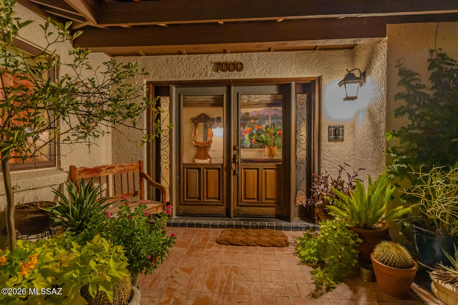 Enter the courtyard to ''Mini Hacienda del Sol''! Large home on a 1.45 acre lot with beautiful grounds,  plus an almost 500 sq.ft. casita! Main home has 5 bedrooms-4 bathrooms-loads of storage, an organized drop zone from the garage. A lovingly-cared for home with many renovations & amenities.  Backyard is truly an oasis for leisure & mountain viewing...2 fireplaces, large covered entertaining patio plus mini patio nooks, built-in BBQs, outdoor kitchen, resort setting with large pool/spa & awesome views! Use of repurposed - historical material thru-out this home. See MORE. Well planned interior & exterior areas for comfort & gathering activities. Guesthouse has good income potential. A truly multi-generational home. See floorplan & list of amenities and improvements attached.