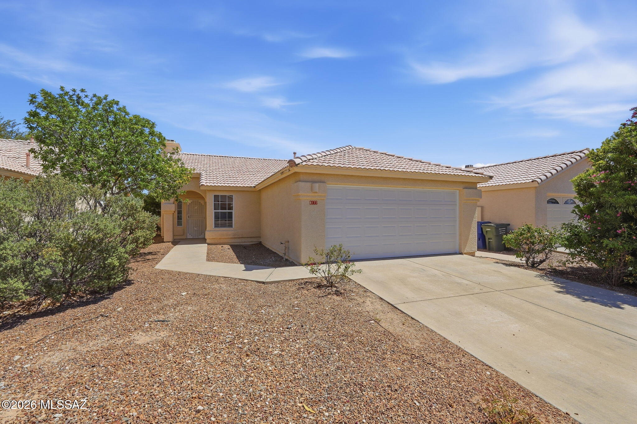 A charming home in a great school district! This open, 3-bed, 2-bath home is perfect for everyday living & entertaining. The family room, with its cozy fireplace, welcomes you as you enter. The kitchen has a gas range, plenty of counter space, cabinets, and a dining area. Unwind on the back patio while enjoying the low-maintenance backyard, complete with a fire pit for the cooler Tucson evenings. The freshly painted walls and tile flooring are a canvas waiting for your personal touch. This home must be seen to truly appreciate!