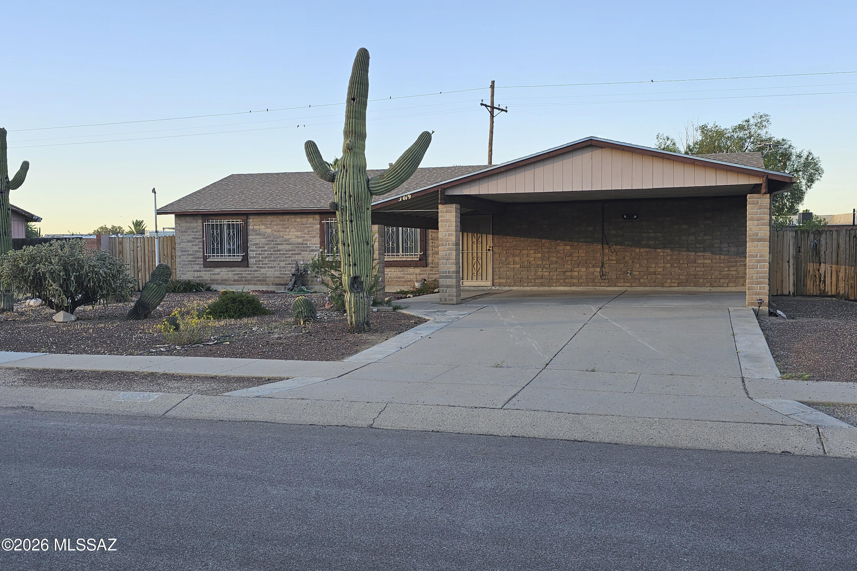 Wildwood Park is a grouping of 414 homes built in the late 80s that is in a GREAT location in Tucson. The community park is a hub for this neighborhood and has great features. People love this area because there is NO HOA and its close to shopping and I-10 freeway. This home is great because of the lower maintenance and sturdy brick construction you dont find in new construction homes any more. Top features are the upgraded windows and a giant laundry room and slightly larger bedroom sizes. The back yard has a large shed plus an oversized gate with alley access (for easy access to store your toys or work equipment). This is an excellent choice, priced lower than the comps to account for future cosmetic updates you may want to make.