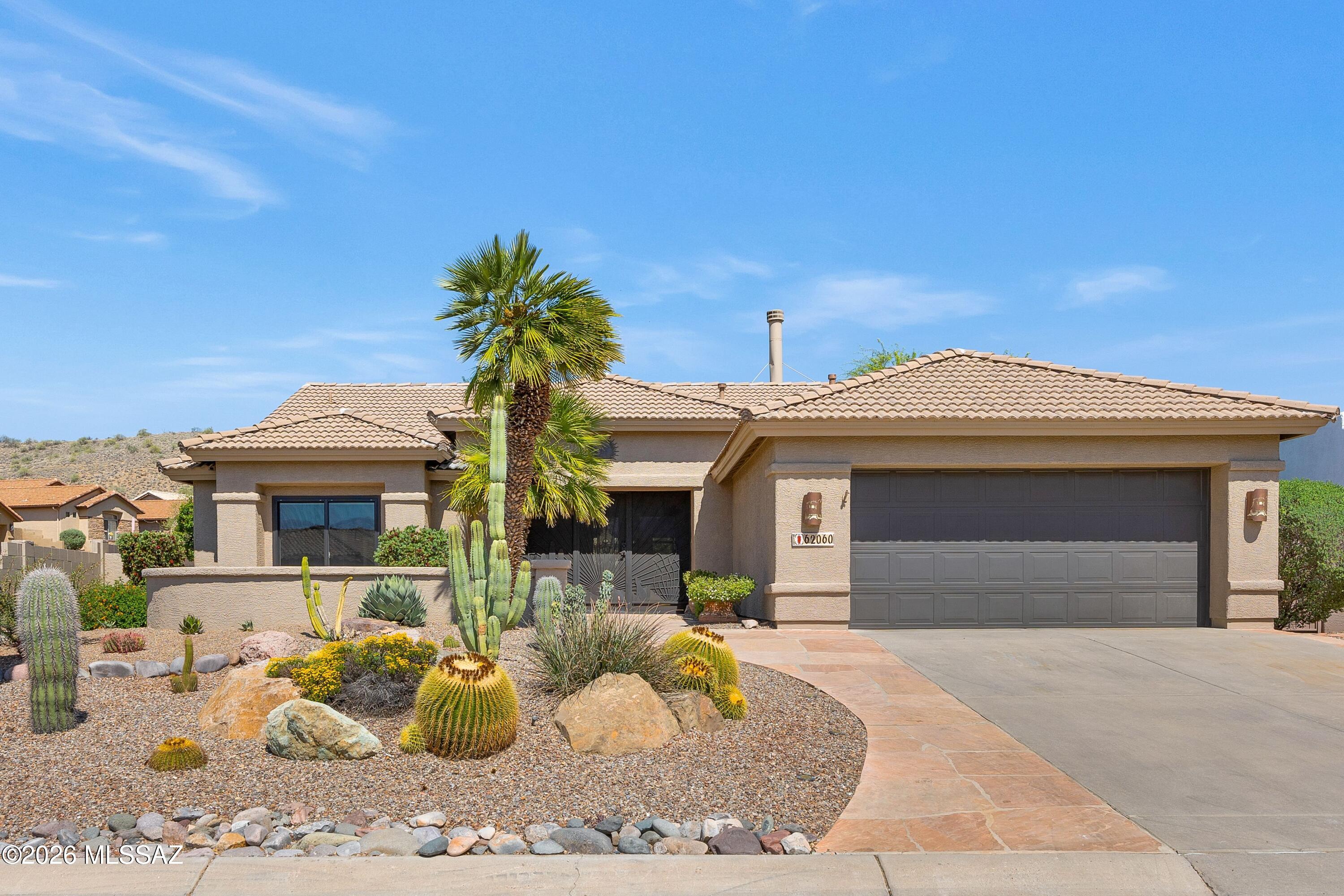 Montana located on corner lot! Enjoy mountain views from front courtyard. Interior painted (2026), roof underlayment replaced (2022), irrigation system updated (2021), Renewal by Andersen windows thru-out, plus recently painted exterior & WaterTec system. Custom entry gate opens to Great Room with see-through gas fireplace shared with family room & patio slider. Kitchen features stainless steel appliances, island, pantry, & cabinets with slide-outs & kitchen nook. Owner's Suite has bay window. EnSuite with walk-in shower & walk-in closet. Guest bedroom has closet & nearby bath. Laundry room with W/D & cabinets. 2 Car garage has 2022 W/H, sink, & storage cabinets. Enjoy covered patio with extended patio, built-in BBQ, cactus fountain, fruit trees, Astroturf, lovely landscaping & gated yard!