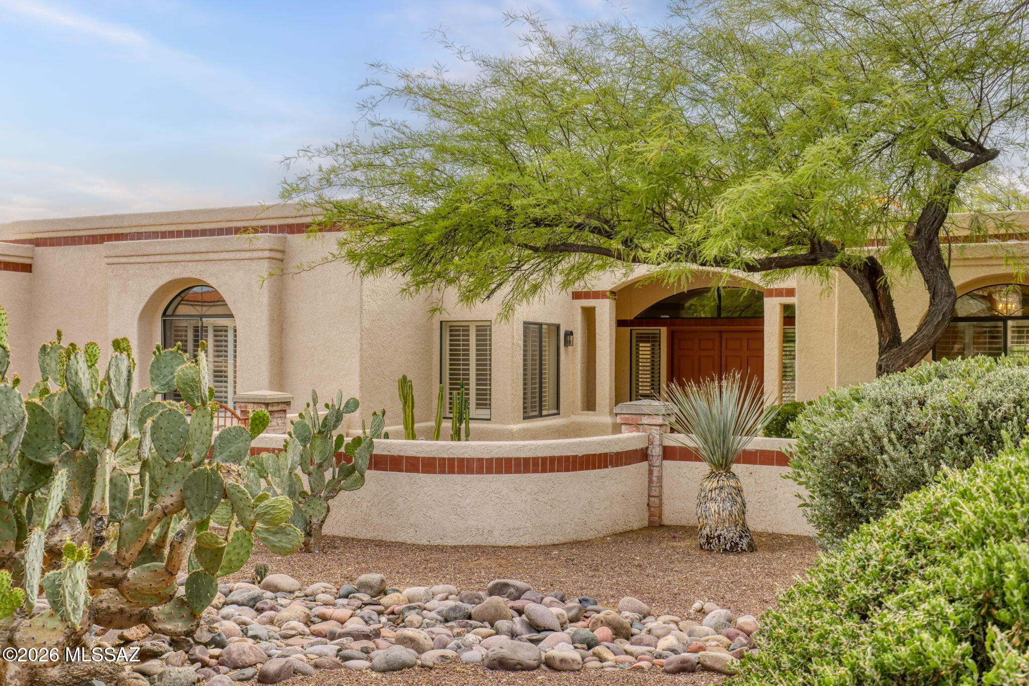 Elevated living meets modern sophistication in prestigious La Paloma Ridge Estates. Located in the desirable Catalina Foothills District 16, this 3,129 SF golf course home offers stunning mountain and fairway views. The split floor plan features a private primary suite with an electric safe, plus a separate guest casita with an updated walk-in shower bath. Enjoy a renovated kitchen with granite counters and GE Profile appliances, plus a stylish new wet bar and wine fridge. Premium updates include a cooled 3-car garage, new pool heater, new water heater, all-new irrigation, and updated laundry. Relax outdoors with covered patios and a separate pool space. Experience the pinnacle of Foothills living!