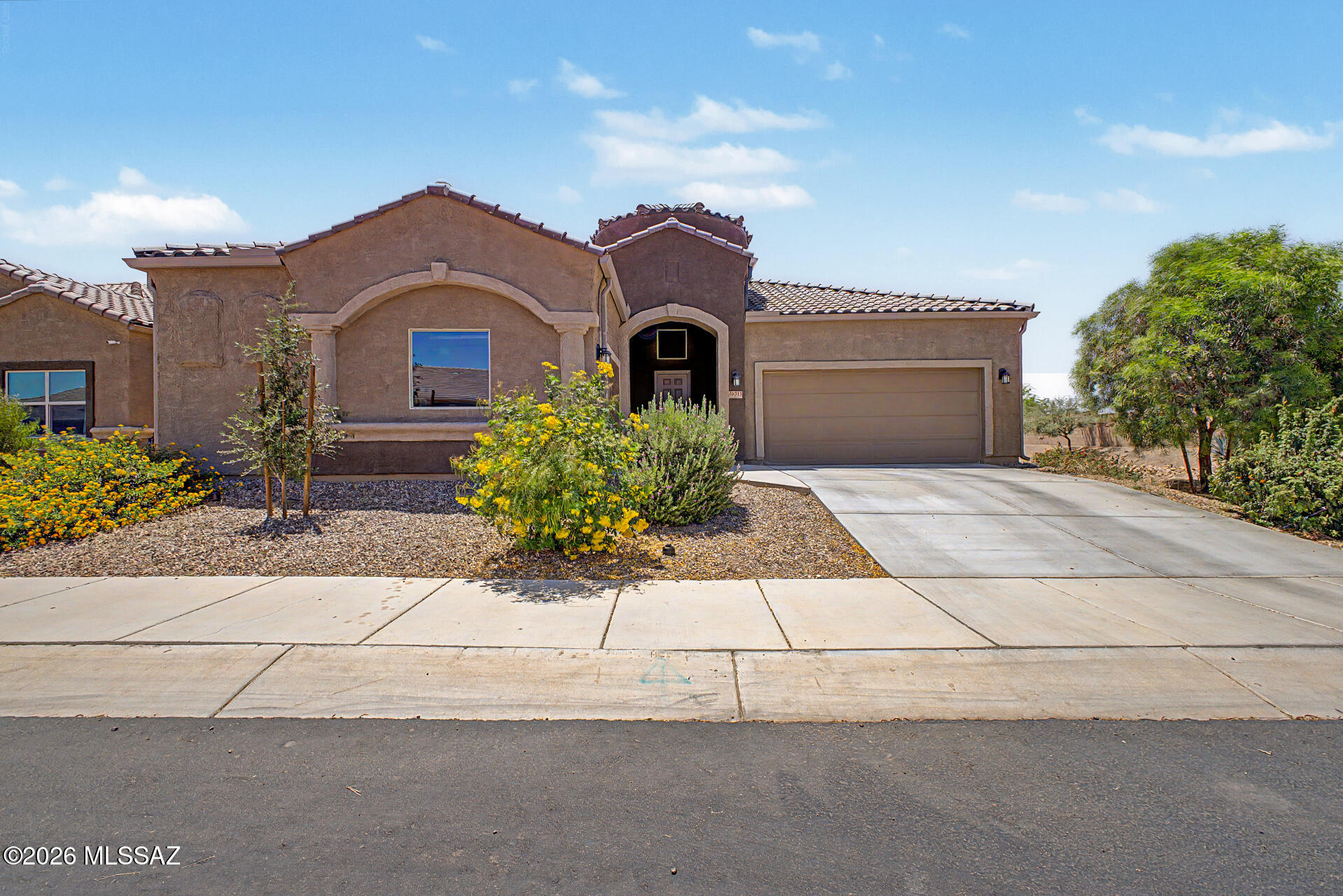 The search is finally over! This beautiful 4-bedroom 3 bath with a den residence called the Savannah, welcomes you with charming curb appeal, a 3-car garage, and mature front landscaping. Inside, you'll love the spacious open layout featuring soaring ceilings, recessed lighting, blinds throughout, and attractive ceramic tile flooring. The gourmet kitchen is designed to impress with granite countertops, chic pendant lighting, crisp white cabinetry with crown moulding, stainless steel appliances, a walk-in pantry, and a large island with a breakfast bar perfect for casual dining and entertaining. Energy-Savings Included! This home comes equipped with a solar system designed to help lock in lower energy costs. Buyers will assume the existing solar lease, offering predictable monthly payments while helping avoid rising utility rates. 
A versatile den provides the ideal space for a home office, study, or flex room. The spacious primary suite offers plush carpeting, a private ensuite with dual sinks, and a walk-in closet. Step outside to an inviting backyard designed for relaxing and entertaining, complete with a covered patio, paver seating area, and a gazebo perfect for dining al fresco. This incredible home is ready for its next owner!