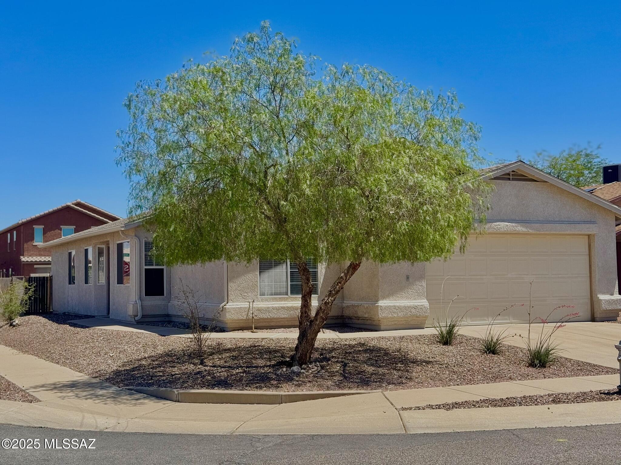 New year, new home! 
Step into this bright and welcoming home tucked inside a peaceful neighborhood with its own park and playground just around the corner. The living room feels open and cheerful with vaulted ceilings and natural light. Sitting on a corner lot, the home offers a little extra privacy and captures lovely mountain views thanks to its north-south orientation. Recent updates include a newer roof and HVAC. With quick access to I‑10 and close proximity to the Pima Air & Space Museum, Saguaro National Park East, Fred Enke Golf Course, Fantasy Island Trails, and Pima Community College East, this location makes everyday living easy and enjoyable.