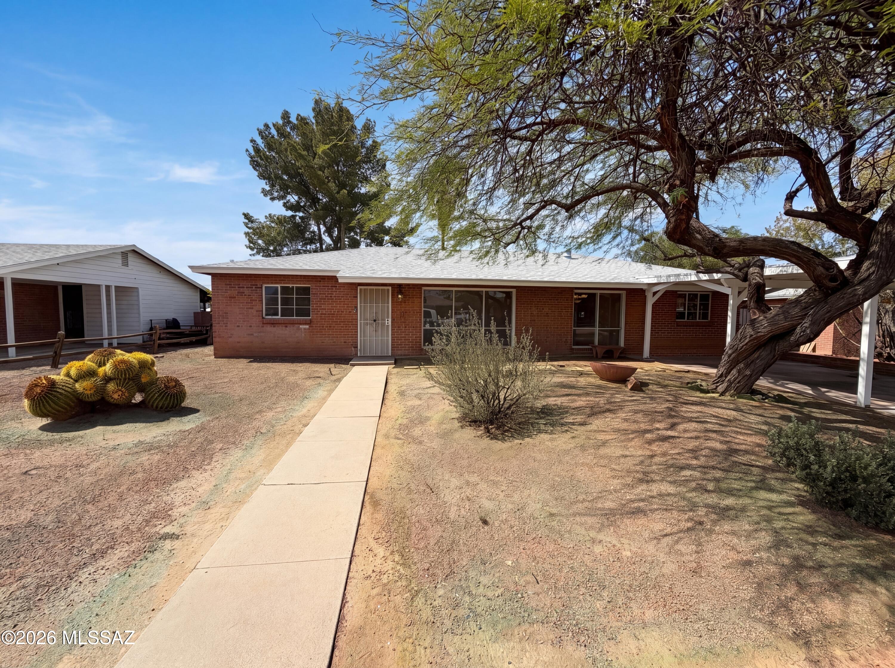 Discover 6611 E Julia St, recently enhanced with a partial flooring replacement throughout its functional layout. The kitchen is equipped with all stainless steel appliances. Beyond the interior, a covered patio overlooks the fenced in backyard, featuring a storage shed and  in ground pool. This updated home with ample outdoor features is a unique opportunity.. Included 100-Day Home Warranty with buyer activation