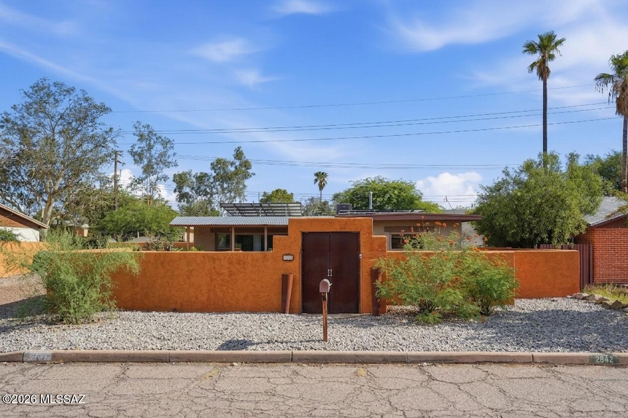 This charming bungalow, set in the historic Broadmoor-Broadway Village neighborhood, is packed with personality and charm from the moment you arrive, beginning with a private courtyard and front porch where you can enjoy your mornings and evenings. Inside, natural light, stained concrete and wood flooring bring warmth and character, while the rustic-style kitchen and living/dining spaces flow naturally.
Step outside and discover even more room in the spacious backyard, with a large covered patio and gated access for additional parking. A standout feature is the fully owned solar, offering the benefit of energy savings without a solar payment. Recent improvements include an HVAC system replaced approximately four years ago, a water heater approximately three years old, and more. You can't beat the location, close to the Treat bike path, Sunshine Mile, Reid Park, Broadway Village, local dining and shopping, the University of Arizona and Downtown Tucson. The voluntary neighborhood association adds to the sense of community through local events, activities and opportunities to connect. With inviting indoor and spacious outdoor spaces, valuable improvements, fully owned solar and a connected neighborhood feel, this isn't just another Central Tucson home. It's one with character, practicality and plenty of possibilities for its next chapter. Schedule your tour today!

For more information on the community, visit www.broadmoorbroadwayvillage.com.