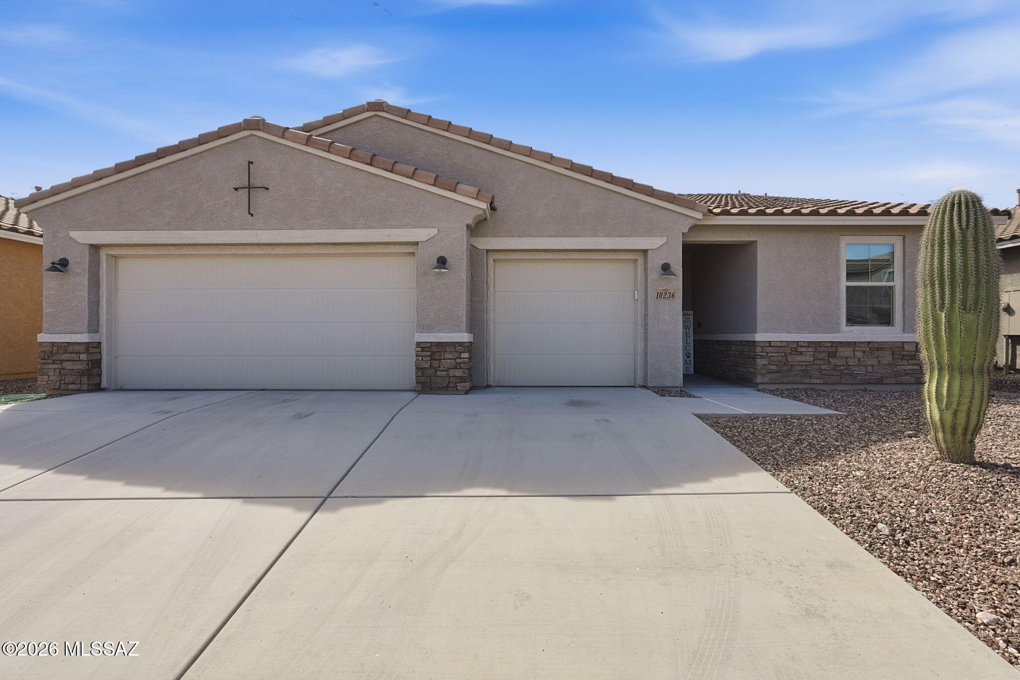 Welcome home to sought-after Saguaro Trails! This 3-bedroom plus den, 2-bath home has 1,928 square feet with plenty of room to spread out. The kitchen is ready for everyday meals or gathering with friends, with quartz countertops, a large island with seating, stainless steel appliances, a walk-in pantry, and a dining area just steps away. Need an office, playroom, or a spot for your hobbies? The den gives you options! The spacious primary suite includes a walk-in closet and a private bath with dual sinks, a walk-in shower, and linen storage. Ceramic tile and upgraded wood laminate flooring throughout make for easy upkeep, while three 12'' solar tubes bring in extra natural light. A custom 8-foot front door with a matching security door, and a large laundry room add to the home's thoughtful touches. Out back, enjoy low-maintenance turf, brick pavers, and a roomy covered patio--perfect for relaxing or having friends over. The 3-car garage has durable epoxy flooring. Enjoy everything Saguaro Trails has to offer, including a community pool, splash pad, parks, dog park, sports amenities, and access to nearby trails, all within the Vail School District.