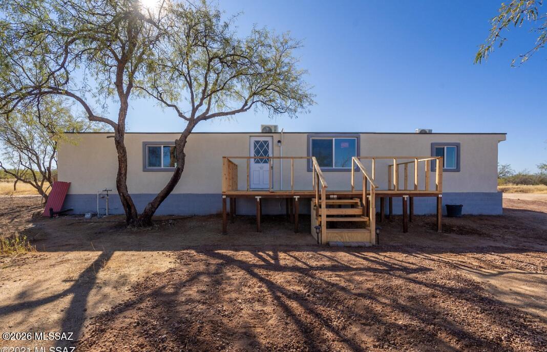 Want nearly 5 acres without giving up access to Tucson? Here's an opportunity that deserves a closer look. Tucked away in the Three Points area, this property delivers privacy, panoramic desert and mountain views, room for RVs, animals and toys, plus no HOA. The affixed manufactured home features a split-bedroom layout, granite kitchen counters and mini-split heating/cooling. Motivated seller with a time-sensitive sale. Seller seeks a qualified buyer and timely closing prior to foreclosure.