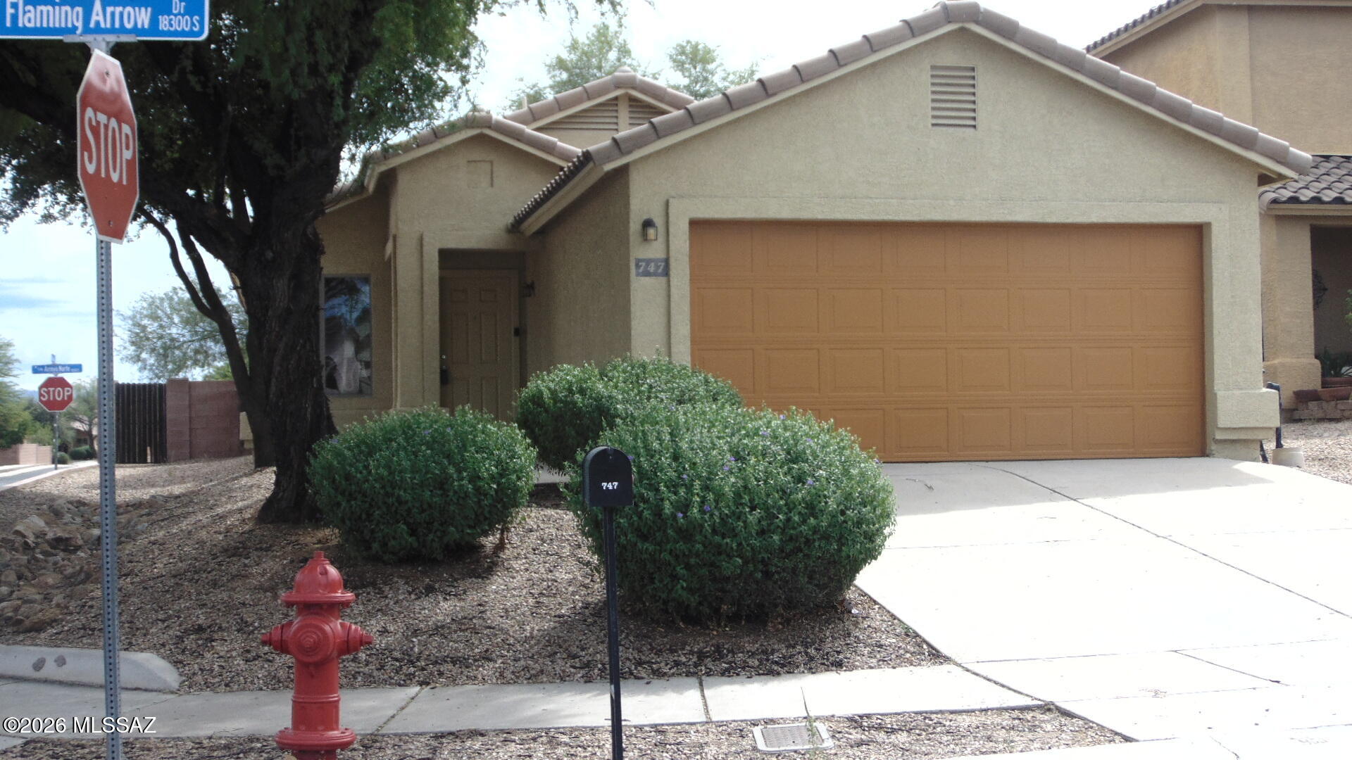 Mountain views from covered back patio, Corner lot, double garage. Spacious Kitchen open to family room.   3 bedroom 2 bath,  wood laminate floors, carpet in all bedrooms