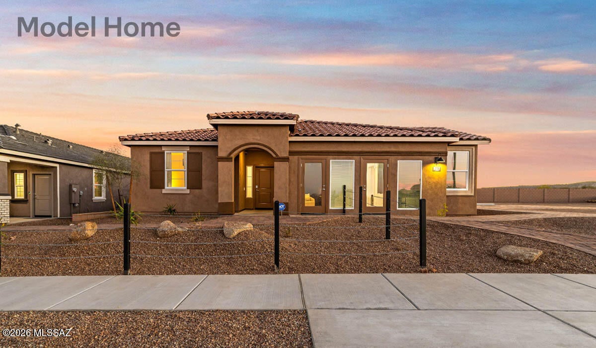 Welcome to the popular Mariposa floor plan, offering 1,897 sq.ft. of thoughtfully designed living space. This single-story home features 4 bedrooms, 3 bathrooms, including a private primary suite and a secondary bedroom- both with their own full baths, perfect for guests or multigenerational living. The open concept layout flows seamlessly from the kitchen to the dining and living areas, ideal for everyday living and entertaining. Located in the highly desirable Rancho Sahuarita community, residents enjoy resort-like amenities, including multiple pools and splash pads, 10-acre lake, recreation centers, fitness facility, pickeball and basketball courts, walking trails, and the popular Safari Park!