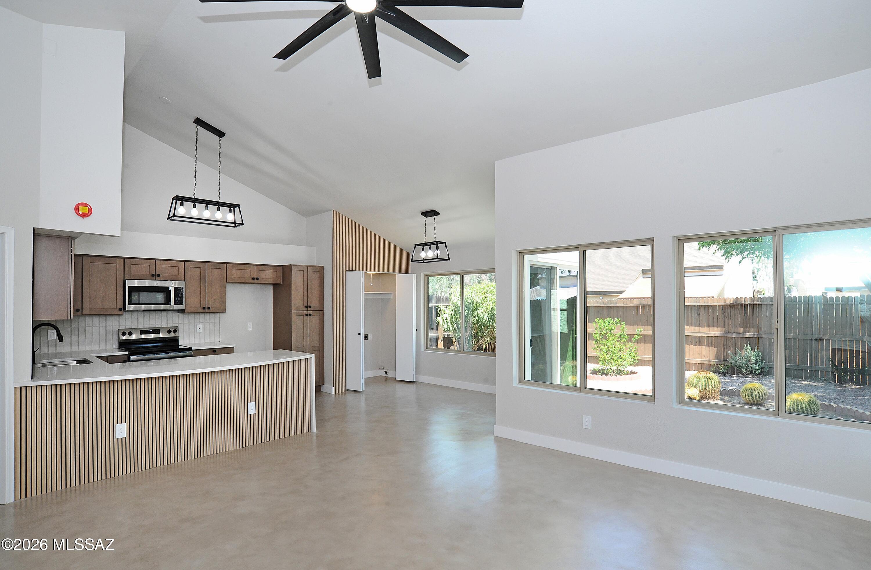 Range priced seller will entertain offer between $280,000-$295,000. Meet your new home! Beautifully updated TH in wonderful conveniently located near east side subdivision. Corner unit with two car garage, open floor plan with huge island and curved quartz countertops. New kitchen, concrete floors, fresh paint inside and out, new shingles and new fixtures. 2 car garage with storage and nice backyard with a squint of a mountain view. You will love this location!!!!  Owner/Agent