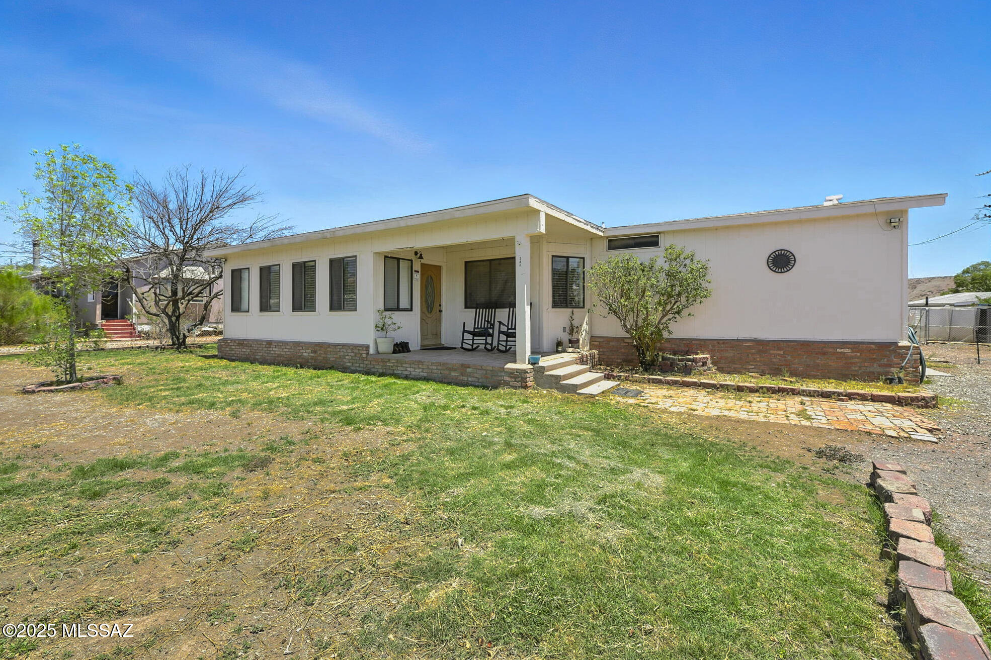 This spacious 4-bed, 2-bath home, spanning 2,387 square feet, is a remarkable opportunity in the Clifton area. Situated in the Loma Linda subdivision, this property features a welcoming front porch and a covered back porch, along with the added convenience of two sheds for extra storage. Inside, you'll find a foyer area leading into a generous great room, complete with French doors. The layout also includes a dining area and a breakfast bar. The sunken master suite features a soaking tub and a Jack & Jill bathroom, making it easily accessible from multiple rooms. Additionally, this home includes a spacious laundry room that doubles as a versatile multipurpose space, offering the flexibility to transform it into whatever suits your needs! This home provides ample storage solutions throughout, perfect for those who require extra space for their belongings. Don't miss out on this opportunity!