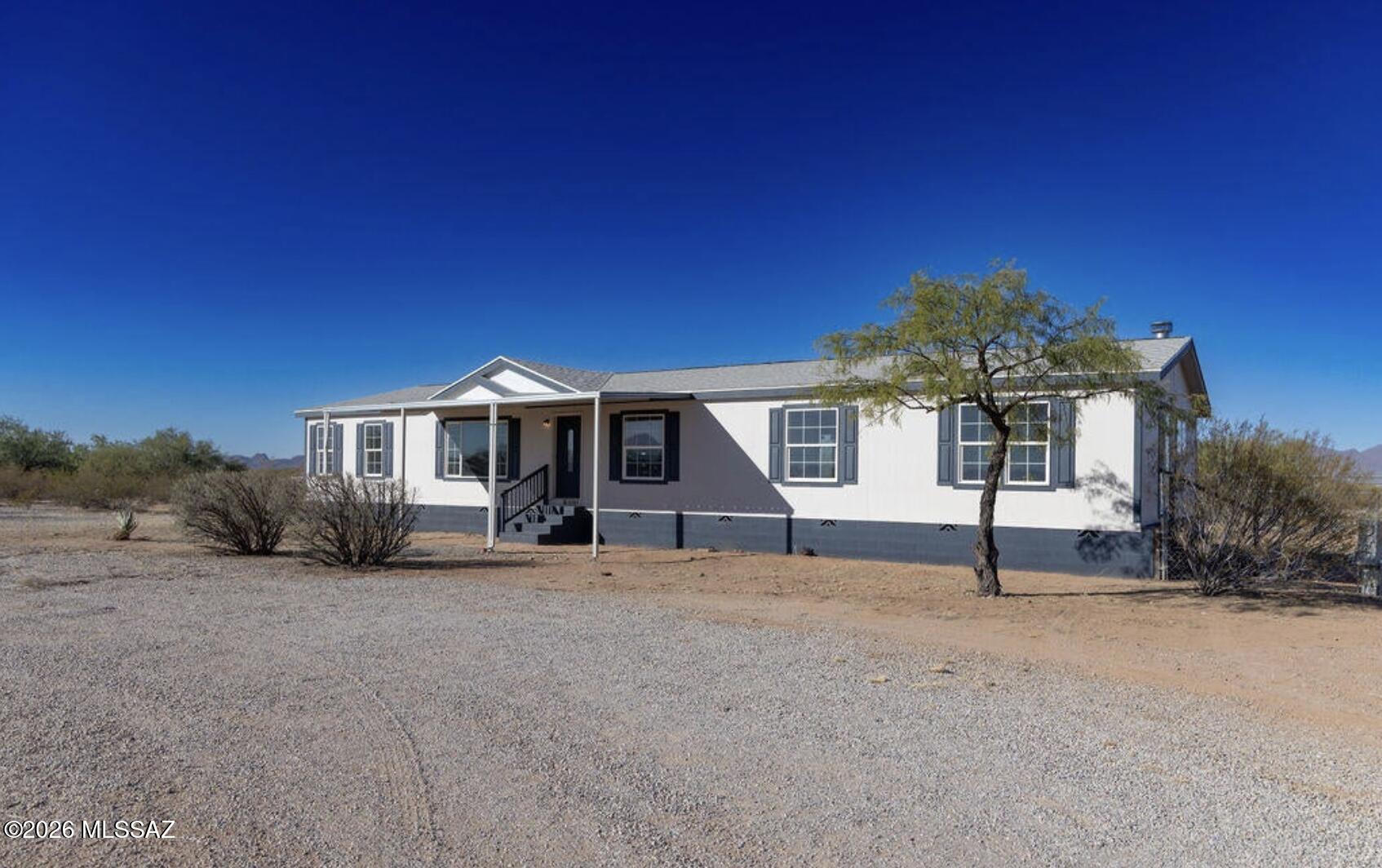 Discover the freedom of wide-open desert living at 10983 N Coyote Cove Road! Situated on approximately 4.72 acres bordering Arizona State Trust Land, this 4-bedroom, 2-bathroom home offers 2,432 square feet of comfortable living space with breathtaking Silverbell Mountain views. Fresh interior paint, an updated primary bathroom, and a recently upgraded A/C system provide added comfort. The expansive acreage offers space for horses, recreational vehicles, outdoor projects, or simply enjoying greater privacy. Take in stunning Arizona sunsets while remaining just minutes from Marana's shopping, dining, and everyday conveniences. A rare opportunity with exceptional space and versatility!