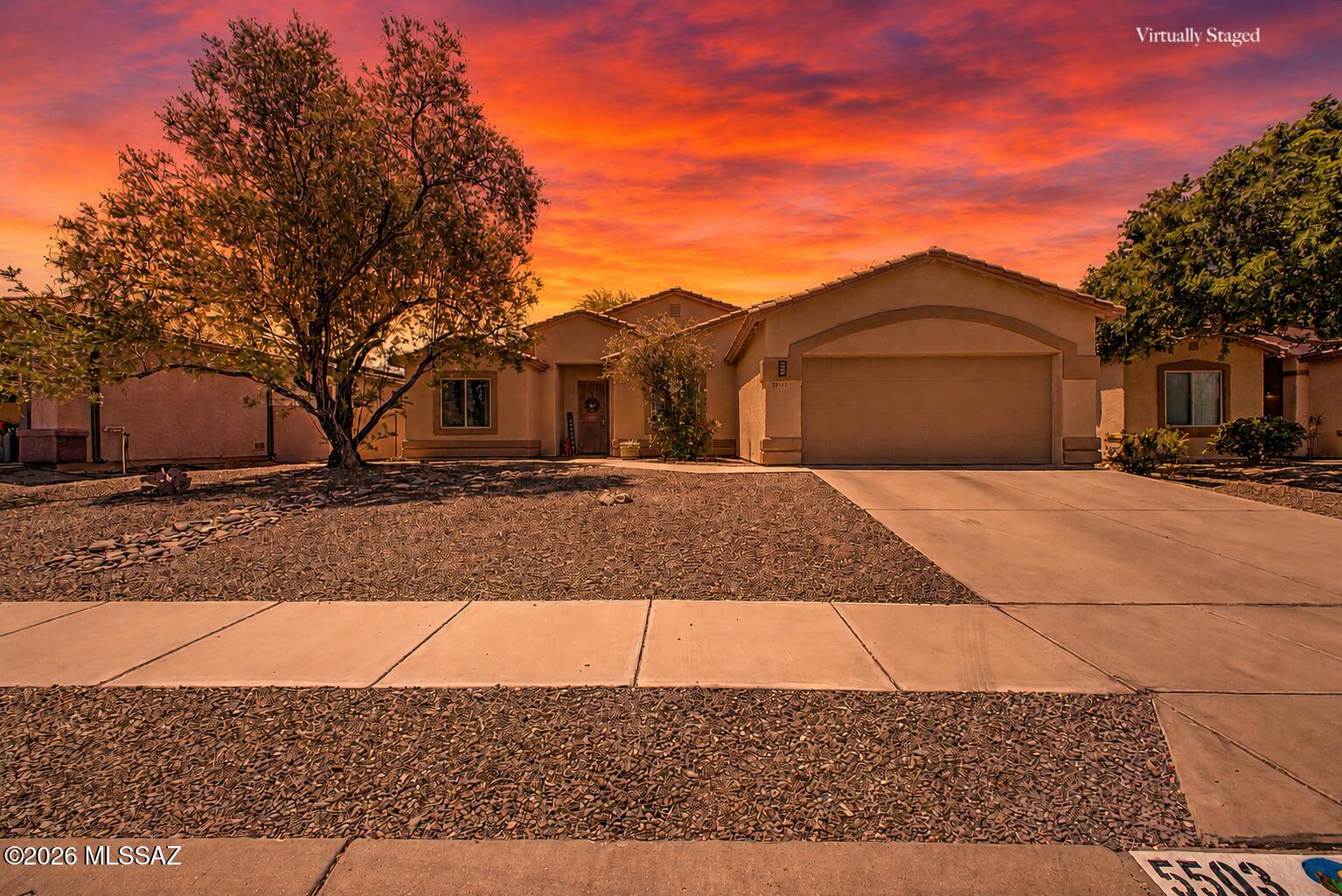 Fantastic opportunity to own this lovely 4-bedroom, 2-bath home where pride of ownership is evident throughout! Step inside to a serene living room with vaulted ceilings, surround sound, abundant natural light, and a comfortable blend of tile flooring and premium carpet. The eat-in kitchen offers abundant cabinetry with pull-outs, recessed lighting, tile backsplash, stainless steel appliances, a pantry, large center island, and a two-tier peninsula with breakfast bar. The split floor plan places the guest bedrooms on the opposite end of the home from the main suite for added privacy. The cozy main bedroom includes an ensuite with double vanities and a walk-in closet. Oversized garage offering excellent storage or room for larger vehicles! Enjoy added value with a newer HVAC system, fresh interior and exterior paint, & water filtration system already added. Out back, enjoy peaceful afternoons under the covered patio, perfect for dining al fresco or relaxing with a refreshing drink. This well-cared-for home is a must-see!