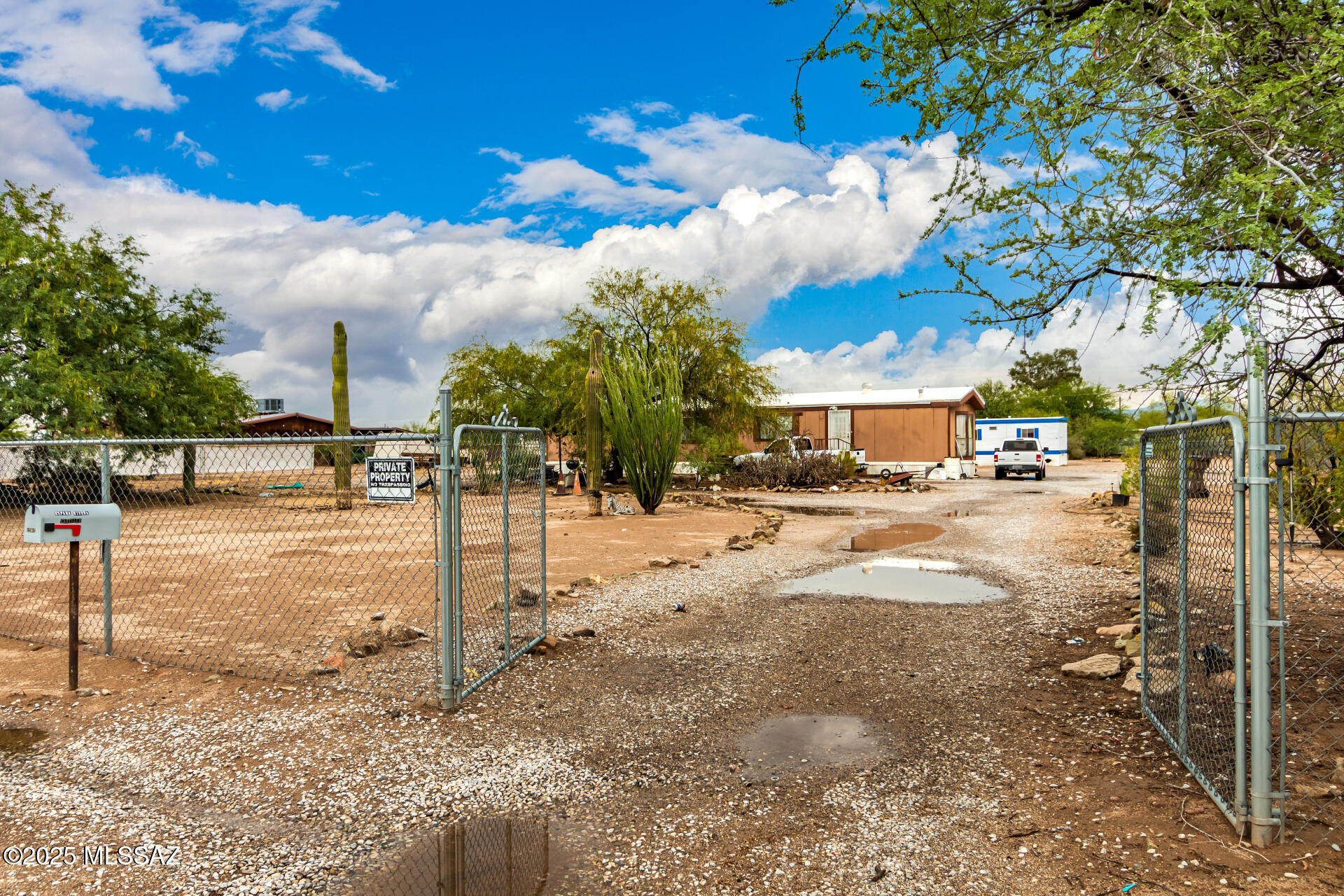 Seize the chance to own this sprawling 1-acre horse property! Welcome to this expansive property, showcasing two mobile residences, each complete with two bedrooms, two bathrooms, a comfortable living space, a kitchen, and outdoor storage sheds. The potential here is limitless; seize this fantastic investment opportunity!