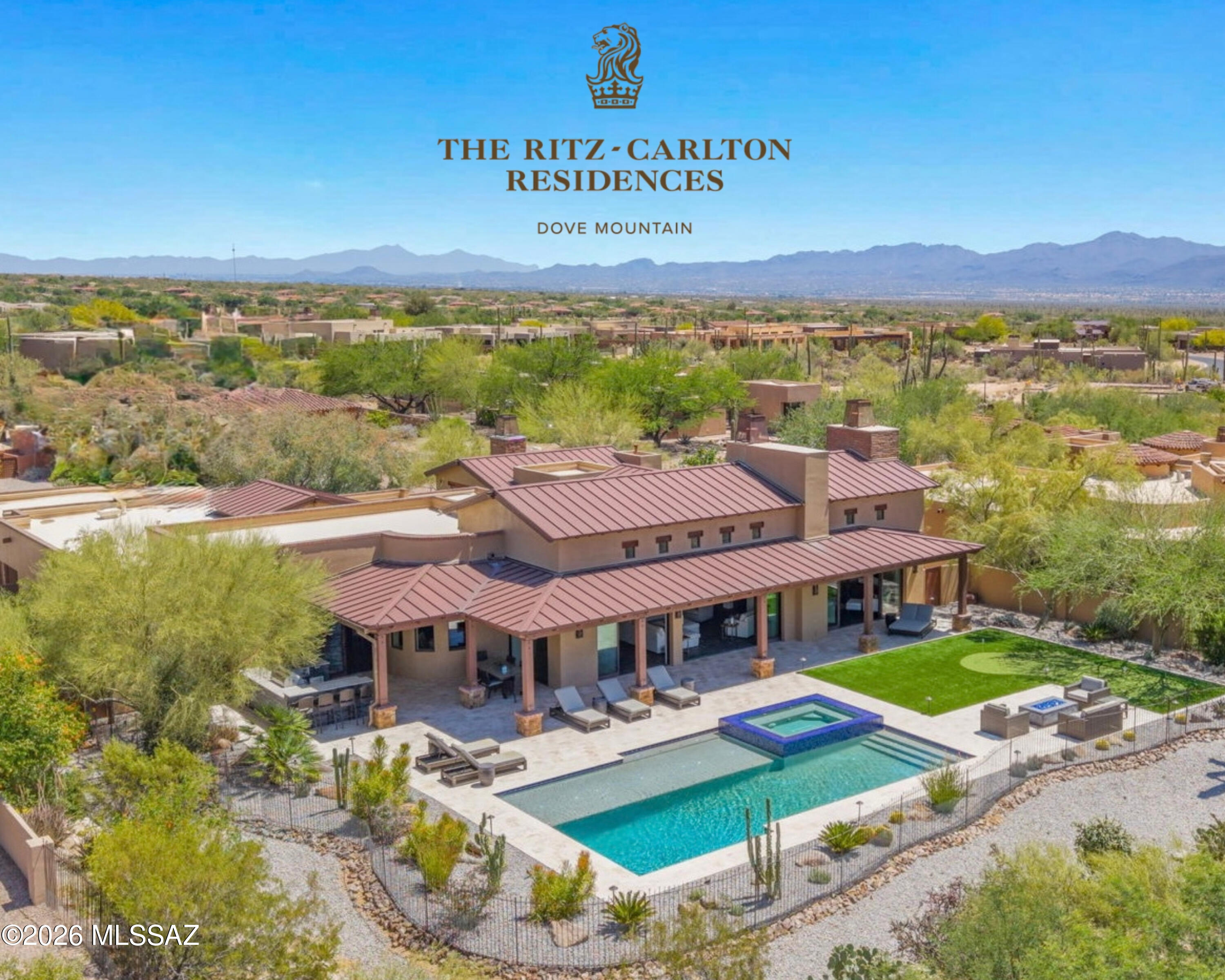 Nestled within the prestigious guard-gated Ritz-Carlton Residences at Dove Mountain, this stunning estate commands breathtaking golf-course and Sonoran Desert views. Designed with refined architectural detail throughout, the home showcases wood-beamed ceilings, expansive picture windows, dramatic retractable glass doors, natural slate and tile flooring, and three elegant fireplaces, creating a seamless blend of sophistication and comfort. Perfectly appointed for elevated entertaining, the home welcomes you through custom entry doors to a picture-perfect backdrop of desert serenity. The main residence spans 4,074 square feet, offering three luxurious bedrooms, each with an en suite bathroom and private patio, plus a private office that can be easily converted into a fourth (see more) bedroom, adding exceptional flexibility. The separate casita offers privacy and comfort, complete with its own fireplace, kitchenette, walk-in closet, and full bathroom all complemented by stunning mountain views. A private patio just off the entry creates the perfect space for guests or can easily be transformed into a home gym, simulator room, office, or flex space to fit your needs.

The private backyard is a true resort-style sanctuary, featuring a luxury saltwater heated pool and spa, overlooking the mountains and golf course, a seating area with natural gas decorative fire pit, a putting green and a custom built-in BBQ area, all set against unforgettable sunsets & mountain views. Retractable living-room doors dissolve the boundary between indoors and out, allowing you to fully embrace Arizona's indoor-outdoor lifestyle. Evenings are elevated by the soft sounds of native flute music drifting from the Ritz-Carlton Resort, creating an unmatched ambiance. The home comes with some furnishings and decor*- see attached list in documents tab. The 3 car garage is fully air conditioned as it used to be a model home, perfect for storage and the desert climate.

Residents enjoy exclusive access to Ritz-Carlton concierge services and world-class amenities, social events, resort amenities, and coordination of any services needed for your arrival if you've been away, delivering a lifestyle defined by elegance, privacy, and effortless luxury.
As part of The Ritz-Carlton Residences, owners enjoy membership at The Golf Club at Dove Mountain