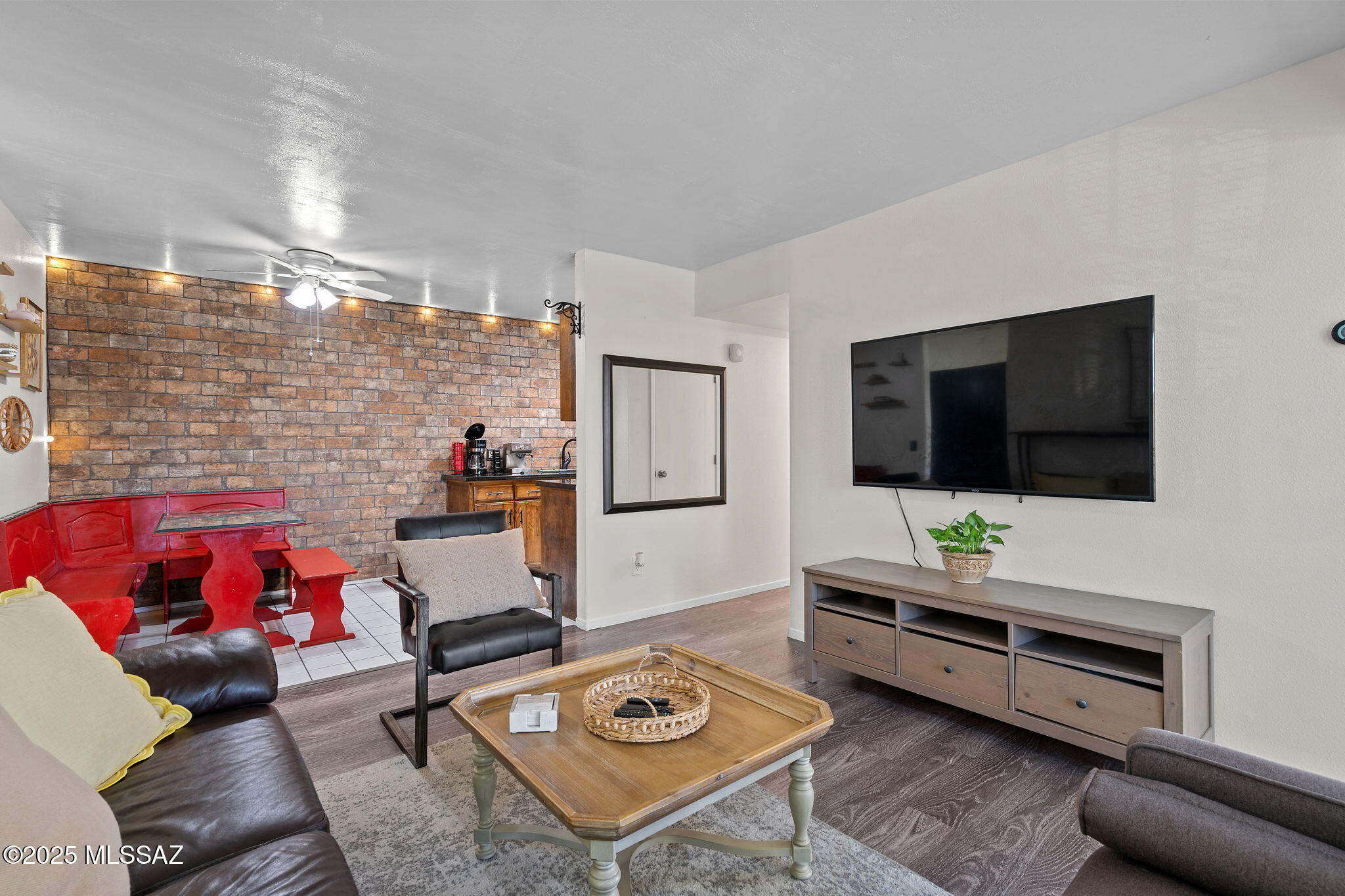 TURN KEY CONDO!! Beautifully updated upstairs 2-bedroom, 2-bath condo offering modern comfort and inviting style. Step inside to upgraded plank wood flooring that flows seamlessly through the living room, bedrooms, and bathrooms. Each spacious bedroom includes its own walk-in closet, providing ample storage. The kitchen features updated granite countertops, and the dining area is accented with a charming decorative brick wall that adds warmth and character to the space. Perfect for first-time homebuyers or investors seeking a strong passive income opportunity, this condo is ideally situated near the Air Force base and just minutes from shopping, dining, and more. Comfort, convenience, and location—all in one place.