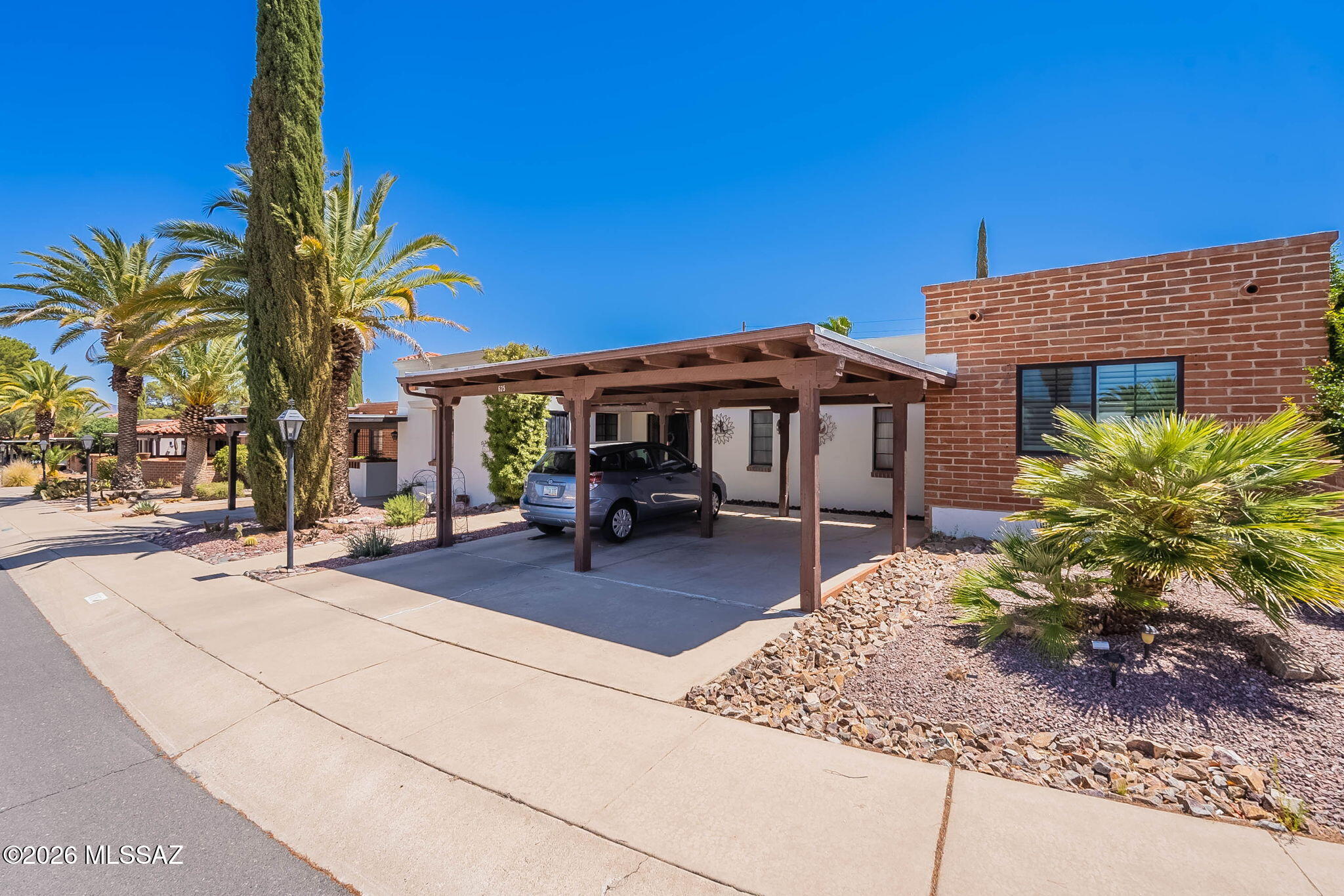 Perfectly positioned in the heart of Green Valley, this inviting 2 BR/2 Bath TH offers comfortable desert living in a prime location. Step inside to discover a spacious, open layout with tile flooring throughout-creating a clean, cohesive feel that's both stylish and easy to maintain. The kitchen features newer appliances and flows seamlessly into the generous living and dining areas, making it ideal for everyday living or entertaining friends. Step outside and you'll find a charming backyard retreat featuring mature citrus trees and vegetable gardens. You'll enjoy peaceful walking trails and friendly neighborhood get-togethers that make GV living so special. Whether you're looking for a full or PT retreat, this home offers the perfect blend of location, comfort, and community.