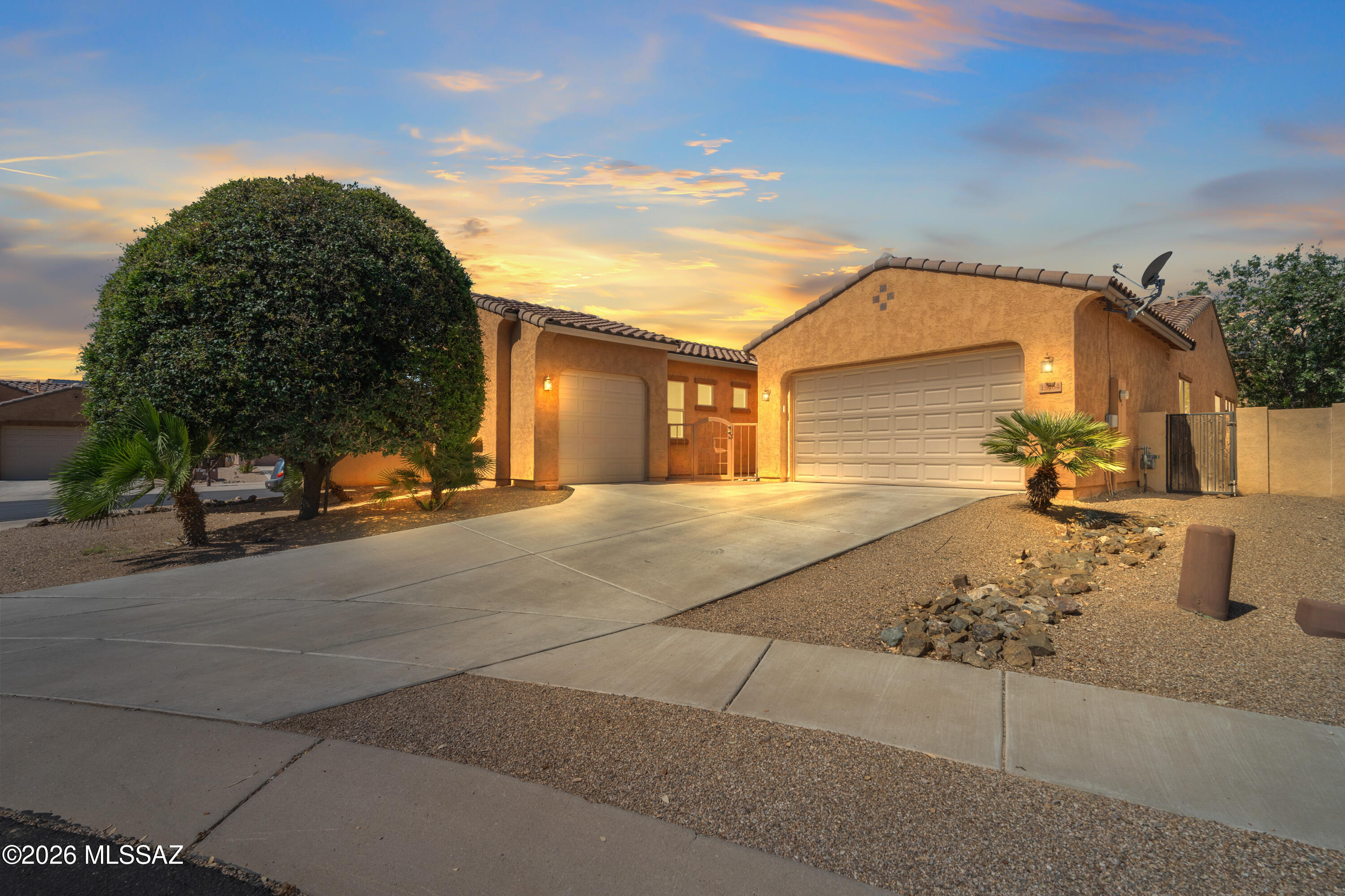 Situated in a private gated subdivision and in a cul-de-sac, this spacious 3 car garage home welcomes with a private gated court yard. Step inside to a welcoming formal dining room, 3 bedrooms, a den and a well-appointed hall bathroom with a tub/shower combination. The primary suite offers a luxurious retreat with dual sinks, a walk-in shower, a soaking tub and a large walk in closet conveniently connected to the laundry room. This home is designed for both everyday living and entertaining. This  home offers a generous family room and an upgraded kitchen featuring: double ovens, cooktop stove, large kitchen island, walk-in pantry and an abundant cabinetry and storage space.  Step outside to enjoy the paver backyard and covered patio, perfect for relaxing or hosting guests. Additional highlights include: Water softener,  close to Anza Trail K-8 School, parks, Rancho Sahuarita Club House, Sahuarita Lake, shopping, dining and I-19.  This home combines comfort, functionality, and desirable amenities in an exceptional location.
