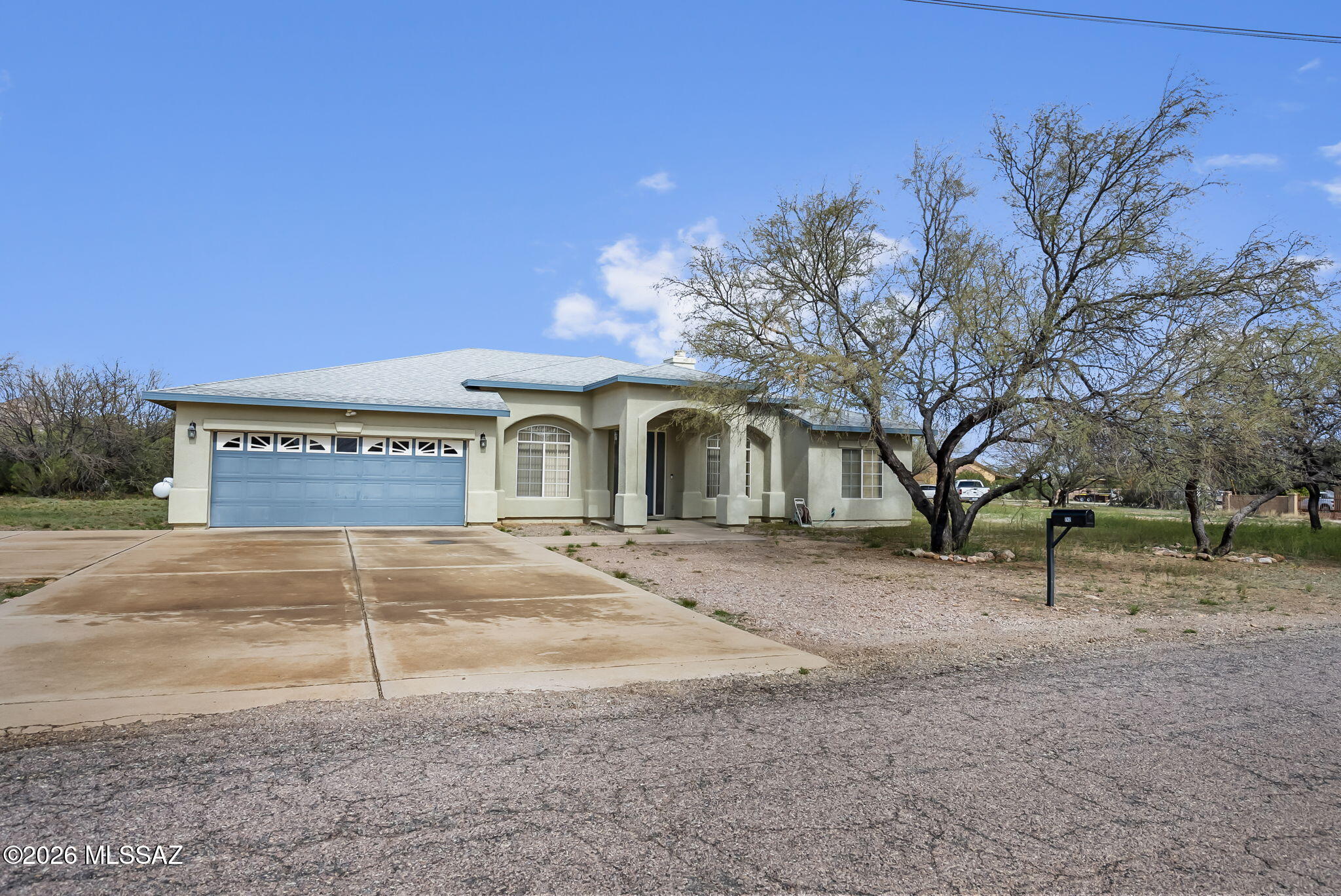 MOUNTAIN VIEWS, SPACIOUS AND WITH MANY BEAUTIFUL FEATURES! This home is designed to accommodate your every need. This is a fantastic opportunity to own this well-cared-for home with 3 bedrooms plus den, and an extra room which can easily be converted to a 4th bedroom. This home is full of charm starting with a welcoming entrance area. As you step inside, you'll be greeted by a large living room with vaulted ceilings & upgraded finishes throughout. It leads you into the open kitchen with upgraded countertops & plenty of cabinet space. All appliances are included.  The home design has a split floor plan. The spacious master bedroom has a large master bath with double vanity and a walk-in closet.  Additional upgrades include a beautiful front door, ceiling fans in all bedrooms, a wood-burning fireplace, ceramic tile floors, and more.   The rear yard has a covered patio area which offers a nice private setting, the perfect spot to unwind & relax.  It is minutes away from the interstate for easy traveling to Nogales/Rio Rico or Tucson, and less than 5 minutes to all that Rio Rico has to offer such as restaurants, walking trails, shopping, and schools. A perfect home to make it your own!
