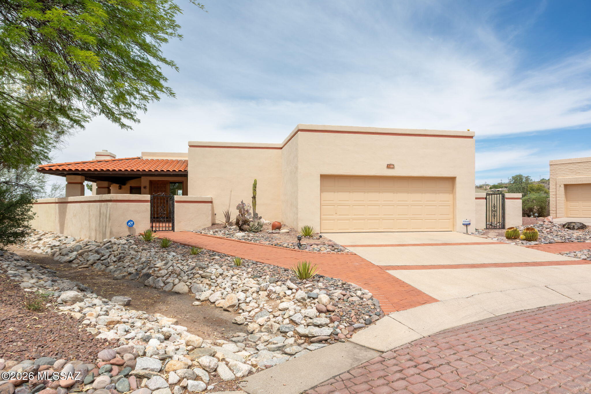 Classic La Quinta built home offering Southwestern charm in a sought-after foothills cul-de-sac location, just minutes from Sabino Canyon Recreation Area. This inviting block home features
warm Saltillo floors,tall ceilings, timeless Mexican tile counters in the kitchen and baths, beautiful Tucson character throughout.The spacious great room includes built-in shelves and a custom fireplace, while the family room
showcases classic beam ceilings.The dining room offers two built-in buffets, perfect for storage,display, and entertaining. Large bedrooms provide comfortable retreats, each with lovely views. Enjoy Arizona outdoor living from the large covered front courtyard or relax on the brick paver patio in back.New carpet, freshly painted interior. Laundry room with an abundance of cabinet Community amenities include a newly renovated pool and clubhouse adding to the appeal of this charming foothills location.