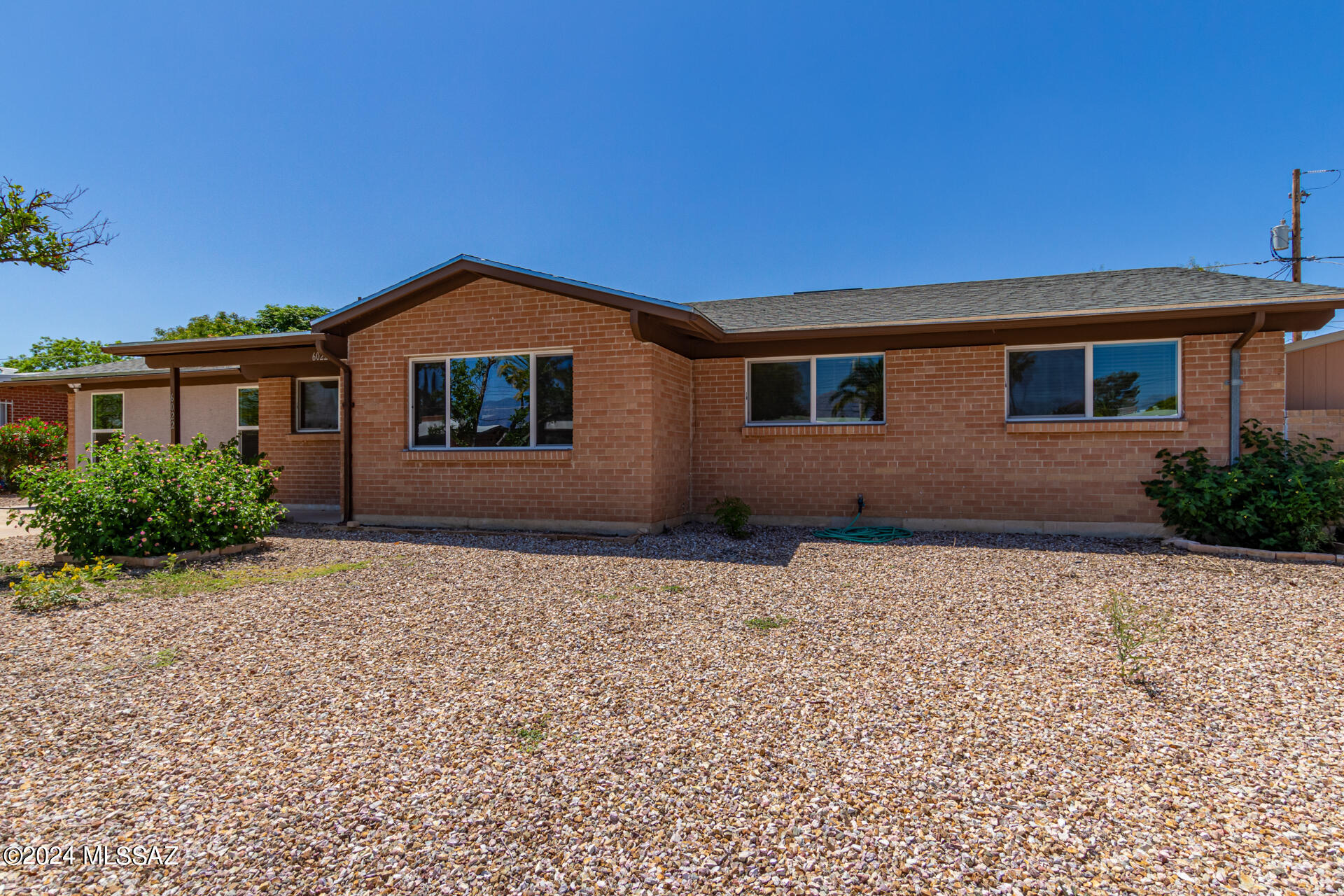 Seller will accept, or counter offers between $400,000 and $415,000. You will love this 4 bedroom house with a huge den/bonus/game/craft/whatever you want room!  Welcome to San Fernando Village! This classic red brick ranch house tucked away in a great mid-town location. Tastefully updated this house has dual pane windows, granite counter tops, stainless steel appliances and classic white cabinets.  The laundry room is large and in charge with a sink, counter space and lots of storage. Enjoy the south facing backyard and never have to worry about watering the evergreen turf. Come and see it for yourself, its even better in person.