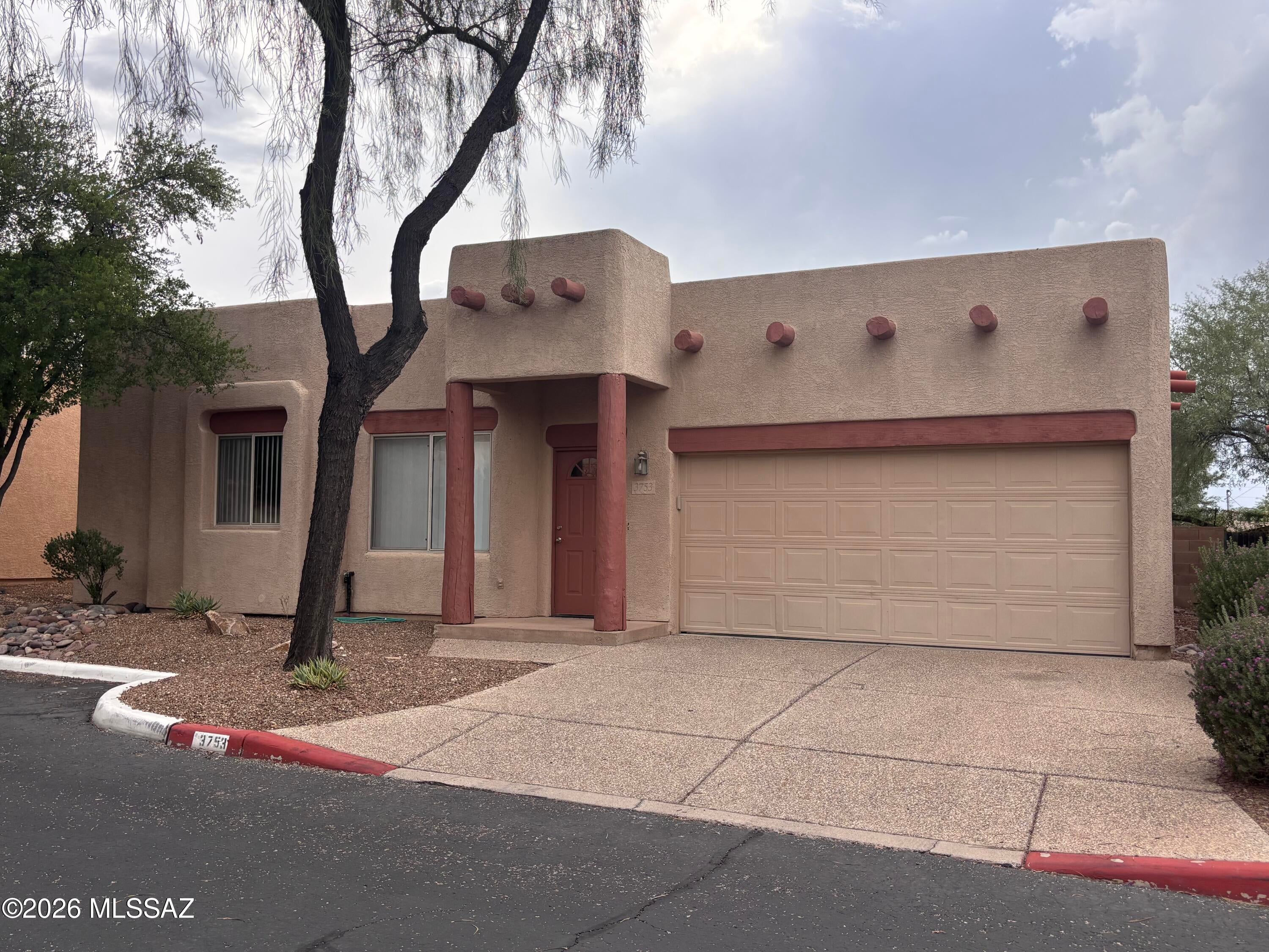 Wonderful home located in secluded subdivision with privacy and charm.  Open floorplan with fireplace, spacious 2-car garage, perfect sized backyard, fresh paint, 3 sliding doors to the backyard and more.  Wonderfully maintained home ready for move-in.   Great location near U of A, Banner Hospital, Trader Joe's, St Philips' Plaza and Farmer's Market, The Loop, bus lines and multiple restaurants.