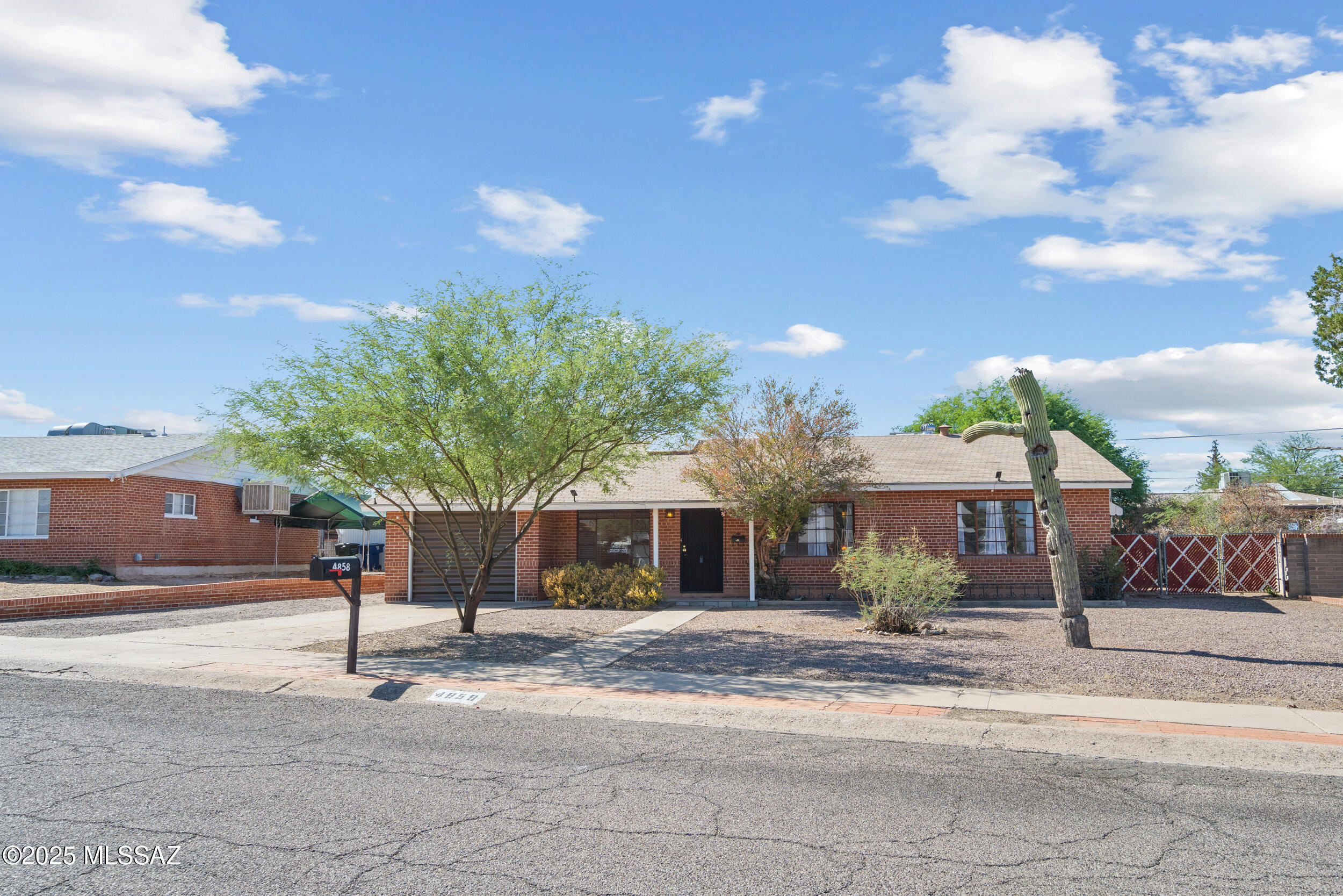 Range priced $300,000-$334,900 Charming eastside Tucson home featuring 3 bedrooms and 2 bathrooms on a spacious lot. The bright, open layout offers a comfortable living area with plenty of natural light, a functional kitchen with ample cabinet space, electric range, microwave & dishwasher & refrigerator. The backyard provides room to relax or entertain. With low-maintenance landscaping, new turf and large veranda. Conveniently located near shopping, dining, schools, U of A & downtown. This home combines comfort and accessibility in a highly desirable midtown neighborhood and just 2 blocks from Hoffman Park.