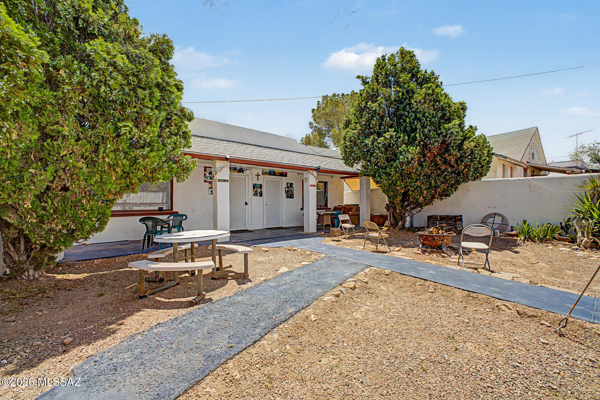 Discover an exceptional investment and lifestyle opportunity in the heart of Tombstone! Just a short stroll from the world-famous downtown Historic Tombstone district, this charming tri-plex offers the perfect blend of character, versatility, and income potential. Whether you're seeking multigenerational living, a lucrative rental property, or a combination of both, this unique property is ready to fit your vision. The property features three separate units, providing flexibility for long-term tenants, short-term vacation rentals, guest accommodations, or private living quarters. Adding even more value is a covered RV parking area with the potential to generate additional income or accommodate your own travel needs. Step outside and enjoy the inviting outdoor gathering space complete with a cozy gazebo and antique fire stove--perfect for relaxing evenings under the Arizona sky or entertaining guests with Old West charm. Located in the legendary "Town Too Tough to Die," this one-of-a-kind property offers endless possibilities in one of Arizona's most iconic destinations. Don't miss your chance to own a truly distinctive property in Historic Tombstone!