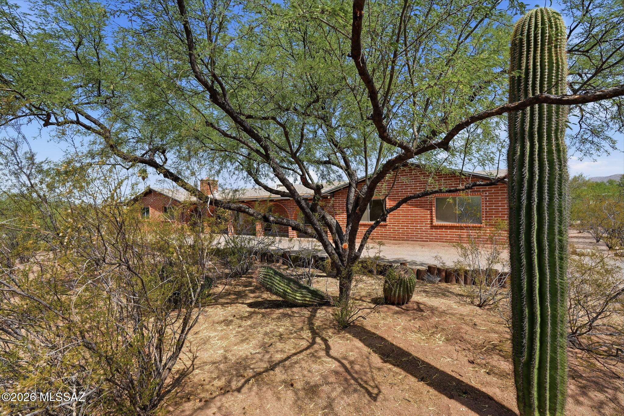 Discover the perfect blend of privacy, comfort, and Arizona living at 11435 E Sundance Dr. Set on a spacious homesite with Catalina Mountain views, this home offers the tranquility of the Sonoran Desert just minutes from shopping, dining, and everyday conveniences The open floor plan is ready for your personal updates and style. Standout features include a 2-year old 7KW fully paid for solar system with 8 batteries, solar hot water, an incredible 6-car garage/workshop with 220V power and air compressor, plus a 50-amp RV hookup. The private backyard is ideal for relaxing or entertaining. A rare opportunity combining energy efficiency, exceptional workspace, privacy and endless potential.
