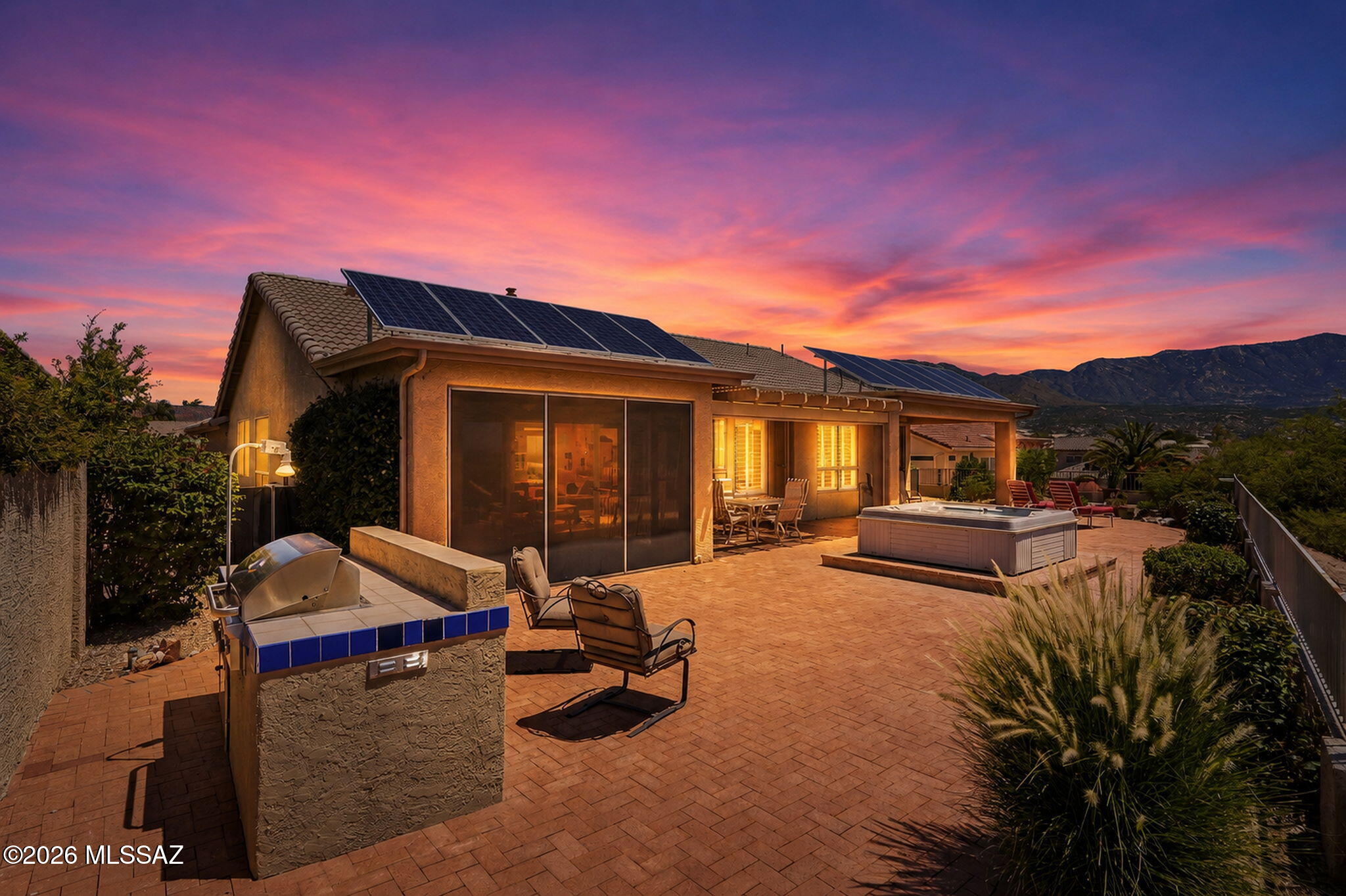 Beautifully appointed Ponderosa model in SaddleBrooke offers 2,309 SF with 3 bedrooms and 2 baths, tucked away on a private cul-de-sac backing to desert open space with sweeping mountain views. Enjoy the scenery, from the back patio, screened Arizona room, or relaxing hot tub. Kitchen features maple cabinetry with pullouts, live-edge granite, prep island, and newer stainless appliances (2021-2023). Family room includes a cozy gas fireplace, while plantation shutters and ceramic tile flow throughout. Spacious primary suite includes sitting area, patio access, and remodeled bath with quartz counters, tile shower, and soaking tub. Owned solar, fruit trees, updated irrigation, fenced patio, and flexible garage options complete the home.
