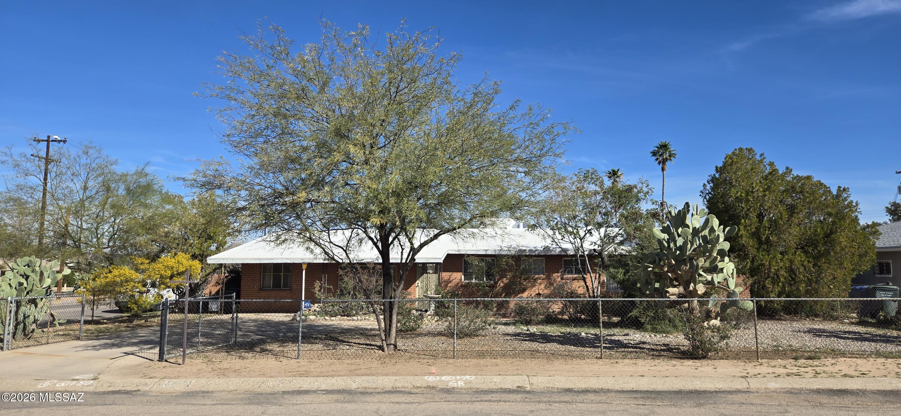 **Investor special** Opportunity awaits at 5901 E 26th St! This 4 bed, 2 bath double brick built home sits on a corner lot in a convenient central location close to shopping, dining, and schools. A great investment property with strong potential to update and add value. The roof was inspected and re-coated in July 2022. No HOA gives you added flexibility. The former carport has been converted into a 4th bedroom, offering extra space for guests or office/hobbies. Home is being sold AS-IS and DOES have visible settling cracks in walls and floors. Great chance to make it your own!