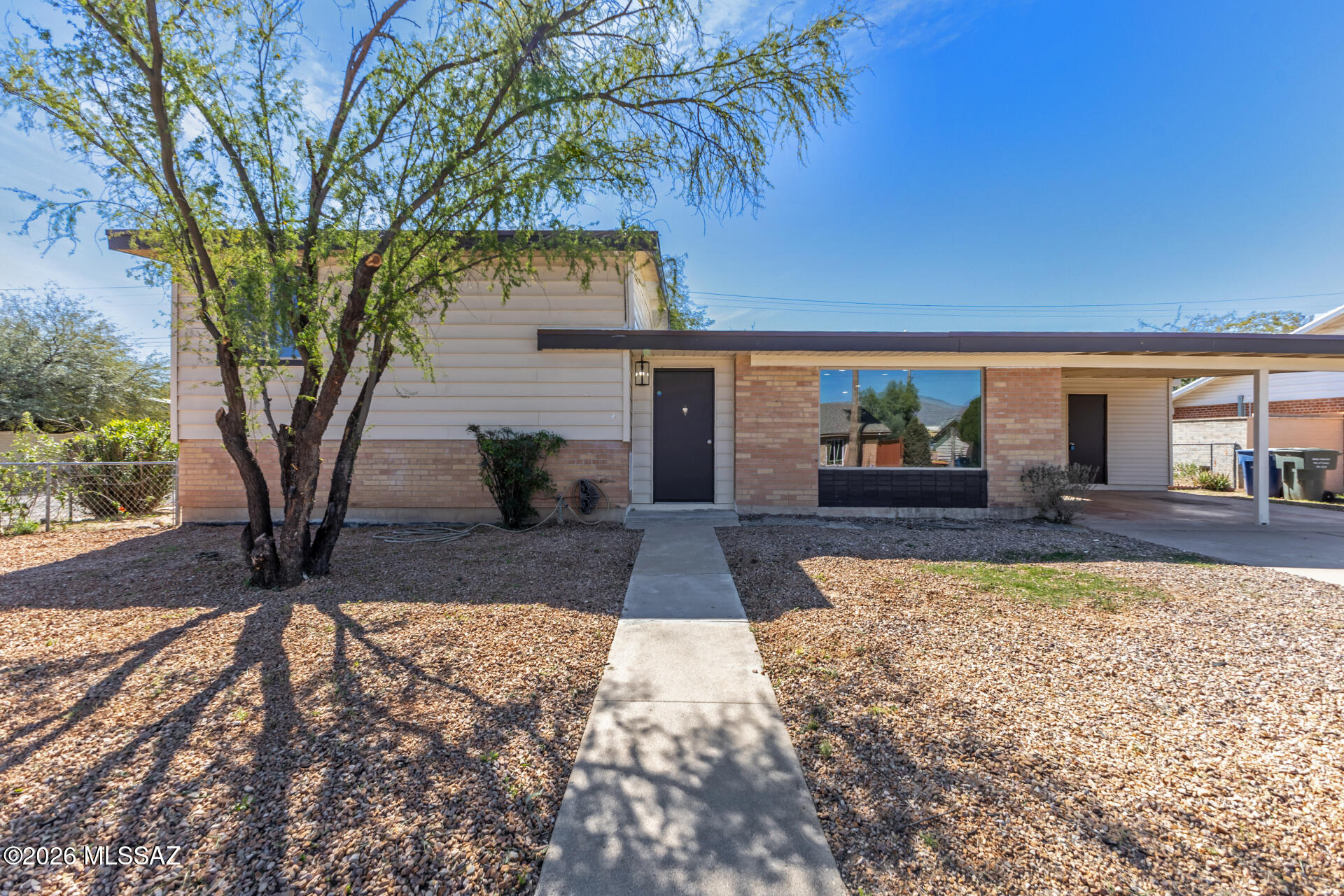 Agent/Owner. No HOA on this multi-split level home situated on a large corner lot with mountain views! Freshly painted interior features ceiling fans, new lighting, updated bathrooms, new carpet and vinyl flooring, plus a spacious great room and dining area. Bonus room offers flexibility for a game room, office or additional bedroom. Kitchen showcases new cabinets, solid quartz countertops and stainless steel appliances including electric range, dishwasher, disposal and exhaust fan. Laundry closet included. NEW central A/C, NEW natural gas forced air heating and NEW roof provide added peace of mind. Exterior offers covered patio/deck, desert landscaping with native plants, new deco rock, chain link fencing, 2 covered carport spaces, RV parking and drive-through gate for backyard access.