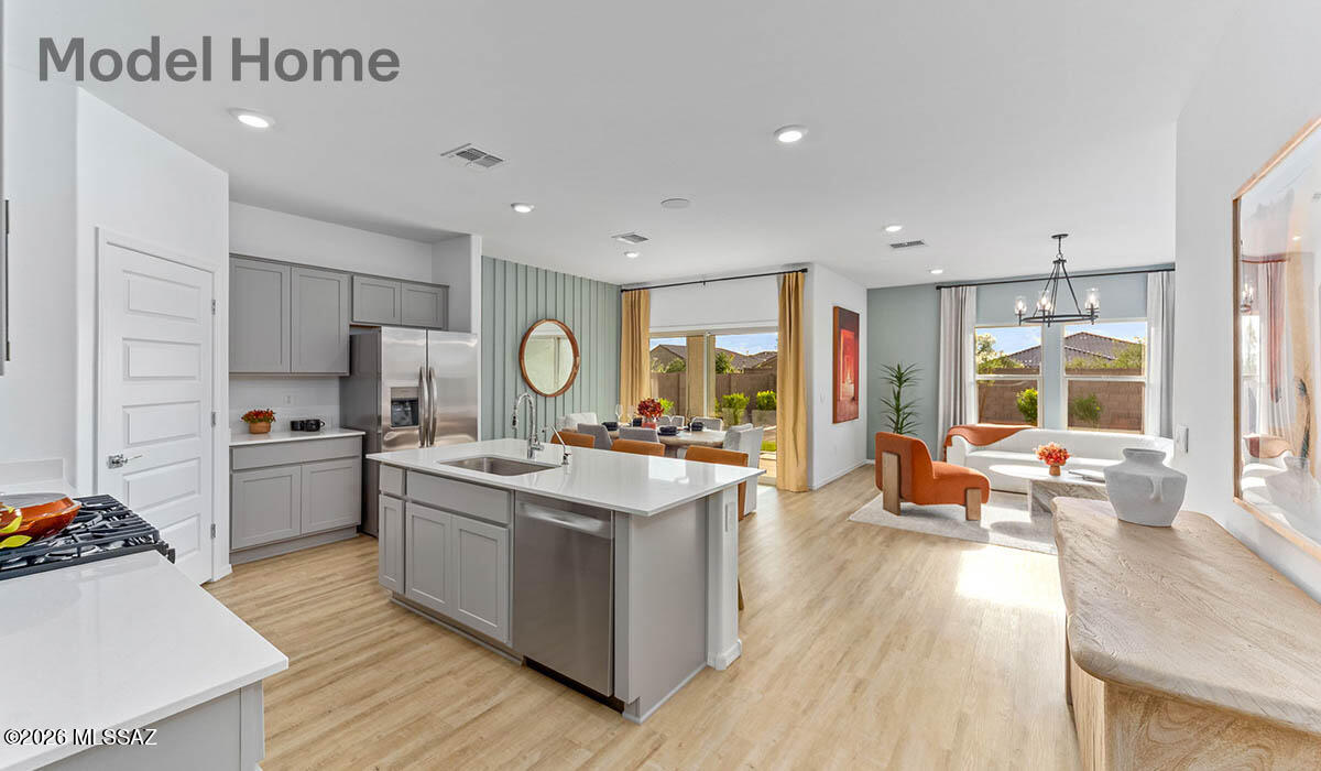 Step into The Cali at Hanson Ridge in Vail, Arizona - a thoughtfully crafted 1825 sq. ft. single-story new home designed to offer a perfect harmony of comfort and elegance.
As you enter through the inviting front porch, you're welcomed into a bright and airy living space that flows seamlessly into the great room, dining area, and kitchen. This open-concept design is perfect for both casual family living and entertaining. The kitchen, with its Quartz countertops, modern appliances, and a convenient pantry, is both stylish and functional, making meal preparation a breeze.
The primary suite, located at the rear of the home, provides a private retreat with a spacious bedroom, a large walk-in closet, and an en-suite bathroom featuring dual vanities and a walk-in shower. Under construction.
