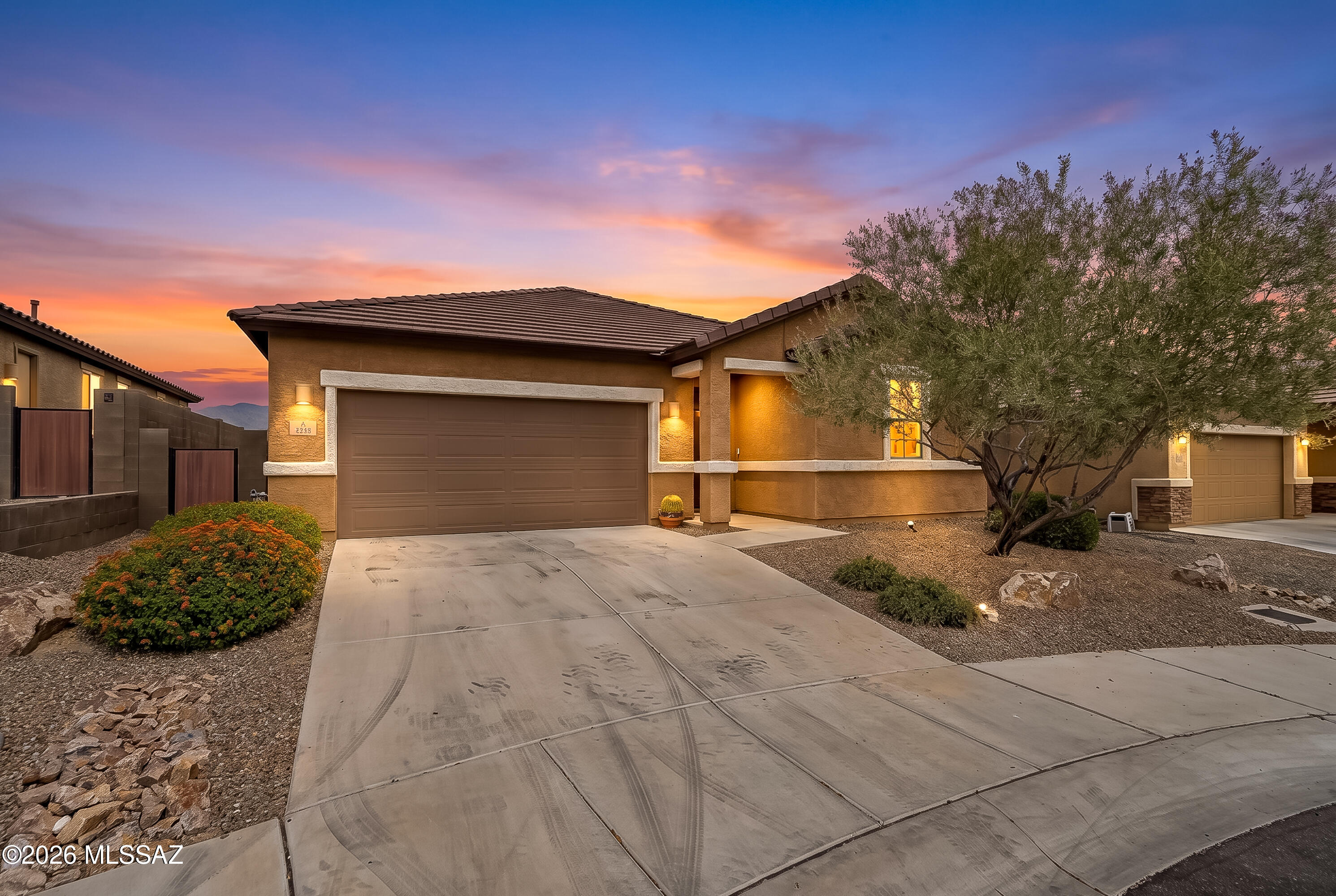Welcome to Willow Vista! This refreshed 3-bed, 2-bath, 1,950 sq ft gem is move-in ready and packed with updates. Enjoy tile flooring throughout, quartz countertops, and a large island perfect for entertaining. The guest bath has been beautifully renovated, and fresh paint gives the whole home a crisp, clean feel. The spacious 2.5-car garage offers room for vehicles, storage, or a workshop. Step outside to a low-maintenance backyard with serene Catalina Mountain views and no rear neighbors -- your own private retreat. Ideally located with quick I-10 access and just minutes from dining and shopping at the new Uptown development.