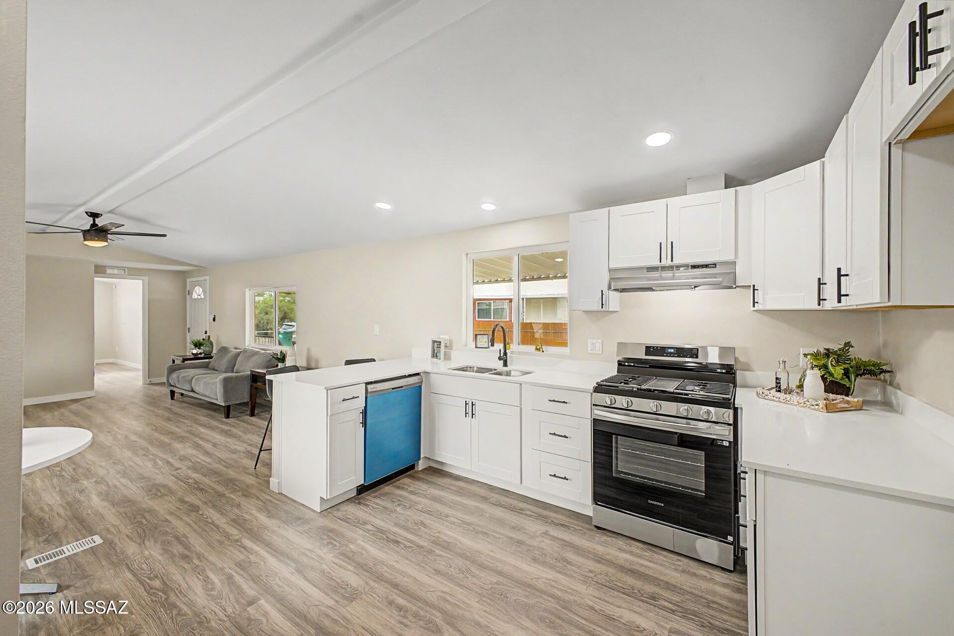 Welcome to this beautifully remodeled 2-bedroom, 2-bath home featuring a spacious yard and numerous upgrades throughout. This move-in-ready property offers all-new flooring, updated bathrooms, a modern kitchen, new roof, and a newer AC system, providing both comfort and style. The open and inviting layout creates a warm atmosphere perfect for everyday living and entertaining. Enjoy the large outdoor space with endless possibilities for relaxation, gardening, or gatherings. Conveniently located near shopping, dining, schools, parks, and other everyday amenities, this home combines modern updates with an excellent location. Don't miss the opportunity to make this charming property your new home!