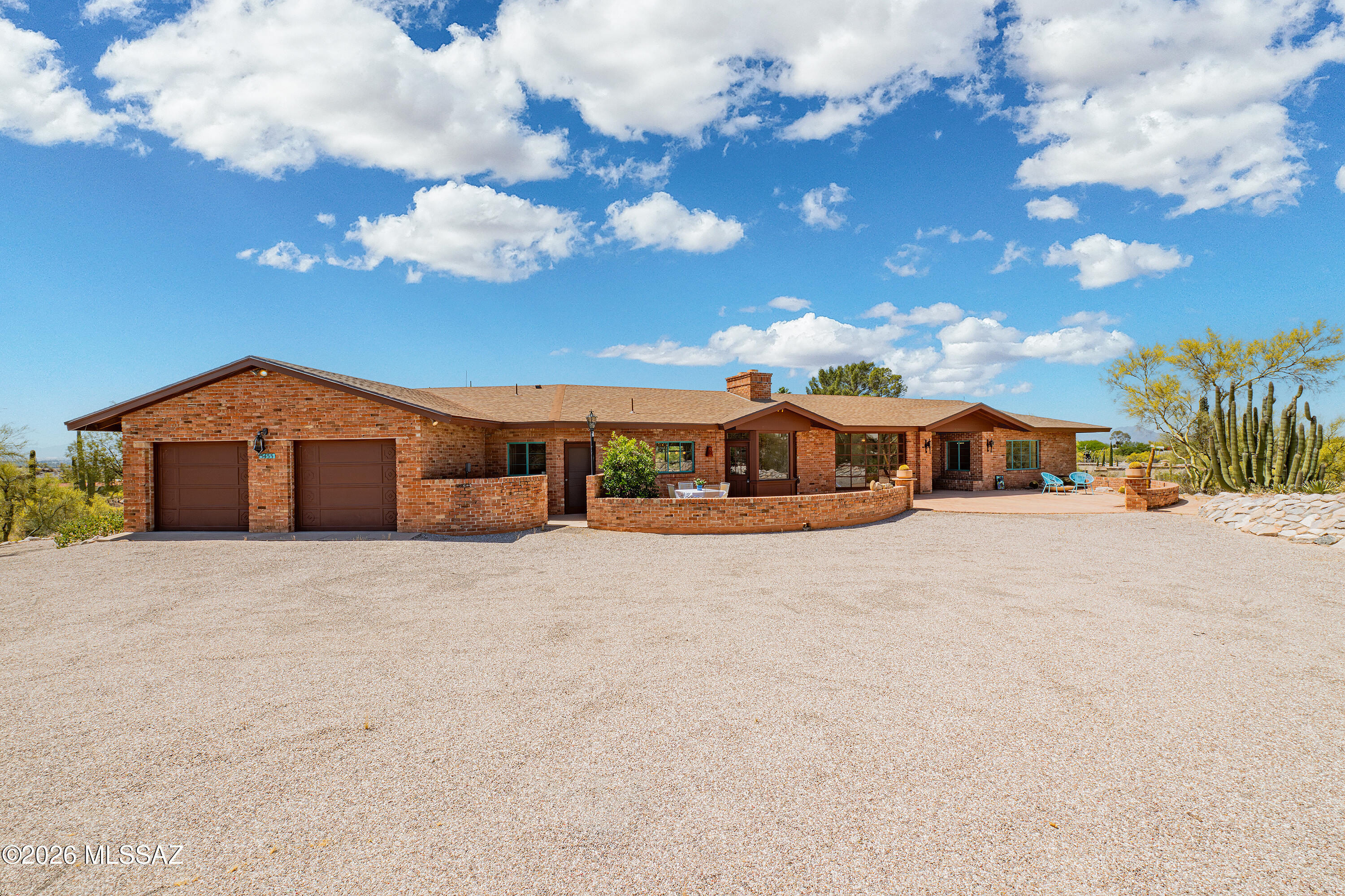 HELLO charming, brick house on 2.7 dividable acres on a quiet, private street in the OLD FOOTHILLS!! Pristine, notable architect ANNE RYSDALE designed home on an incredibly peaceful HILLTOP LOT w/ perfect north/south orientation & ABSOLUTELY GORGEOUS VIEWS! Unique brick mid-century modern style fireplace w/ charming vintage tile. Huge ''curved'' living room window frames the majestic mountain views! Spacious, open living room. Concrete floors throughout. All one level, perfect split floor plan! Large front & rear patios create both intimate settings & ideal entertaining spaces. Enjoy swimming in the large ''keyhole'' shaped pool surrounded by gigantic saguaros & mature cacti. SIMPLY A RARE OLD FOOTHILLS GEM! See DOCUMENTS ATTACHED & ask for details regarding potential 1 acre lot split.