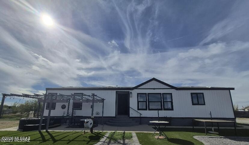 This immaculate affixed manufacture home sits on 1 acre of land with privacy fencing on entire home.This home offers new exterior paint,separate garage barn shed,car port,exterior carport shed has also been painted.Outdoor ameneties include RV hook up,extended patio with pavers,artificial grass,2 patio Gazebo,chicken coop,green house, also installed. Fruit trees planted 2 pomegranates,1 fig,1 peach,1 apricot tree.Complete interior has new paint,new wood laminate throughout the whole home.Kitchen includes new quartz countertops,backsplash tile,wine fridge,and new faucet.Brand new appliances include refrigerator and LG Thin Q washer and dryer.New hardware in all restrooms.Must see!Call to schedule your showing. Home is selling AS-IS.