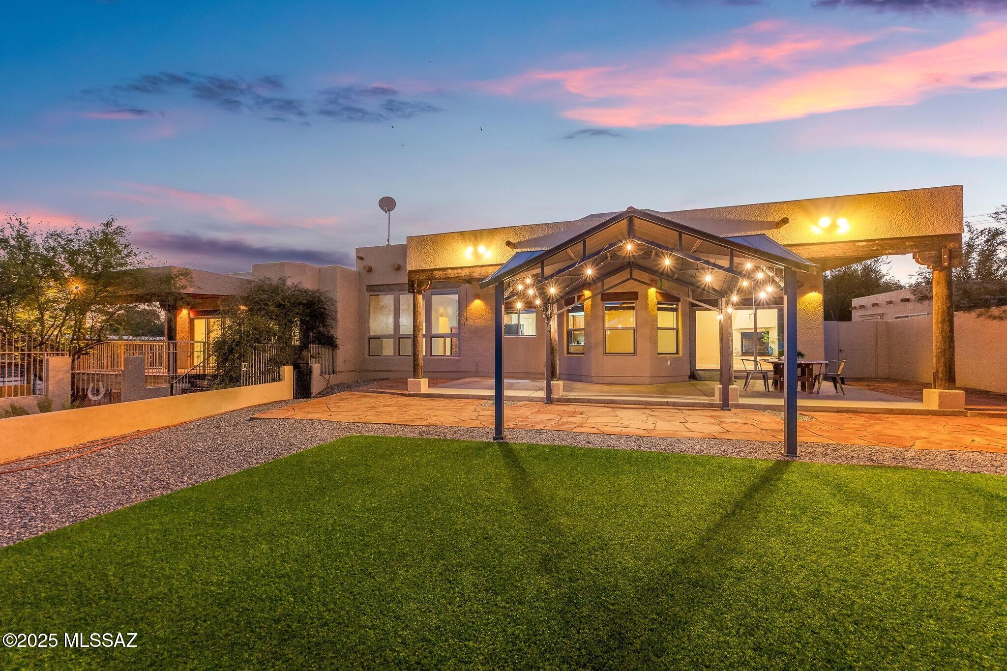 This remarkable 1.80-acre estate offers an exceptional blend of space, privacy, and authentic Sonoran Desert living. Set against sweeping views of the Catalina Foothills and Rincon Mountains, the property delivers unforgettable sunrises, golden sunsets, and a tranquil desert backdrop that feels worlds away yet remains close to everything Tucson has to offer. A rare equestrian-ready setup features a lighted horse arena with water, ready for immediate use, an extraordinary advantage for horse enthusiasts or those seeking true lifestyle flexibility. The grounds also include a new oversized Tuff Shed, two additional storage structures ideal for tack, gear, or hobbies, and ample space for recreational vehicles, desert toys, or future enhancements. Inside, the home is designed to celebrate seamless indoor-outdoor living. An expansive wall of windows in the main living area beautifully frames Rincon Mountain vistas, while wood-beamed ceilings, warm architectural accents, and natural textures create an inviting desert elegance. The open kitchen shines with granite countertops and an island, a farmhouse sink overlooking the private backyard, and effortless flow into the adjoining family room, complete with a cozy corner gas fireplace and direct patio access perfect for entertaining or peaceful evenings under the stars.
The primary suite serves as a private retreat, featuring its own private patio for morning coffee or sunset unwinding, along with a spa-inspired bath offering a garden tub, a large tiled walk-in shower with multiple shower heads, dual vanities, and a luxury Toto bidet.
Additional highlights include a 50-amp RV pad with washout, 3-car garage, newer windows, fresh interior paint, and updated HVAC systems ensuring comfort, efficiency, and move-in readiness. With NO HOA, the property offers unmatched freedom to personalize your lifestyle, whether equestrian, recreational, or simply serene desert living. A rare opportunity to live surrounded by desert beauty, private, peaceful, and ready for your lifestyle.