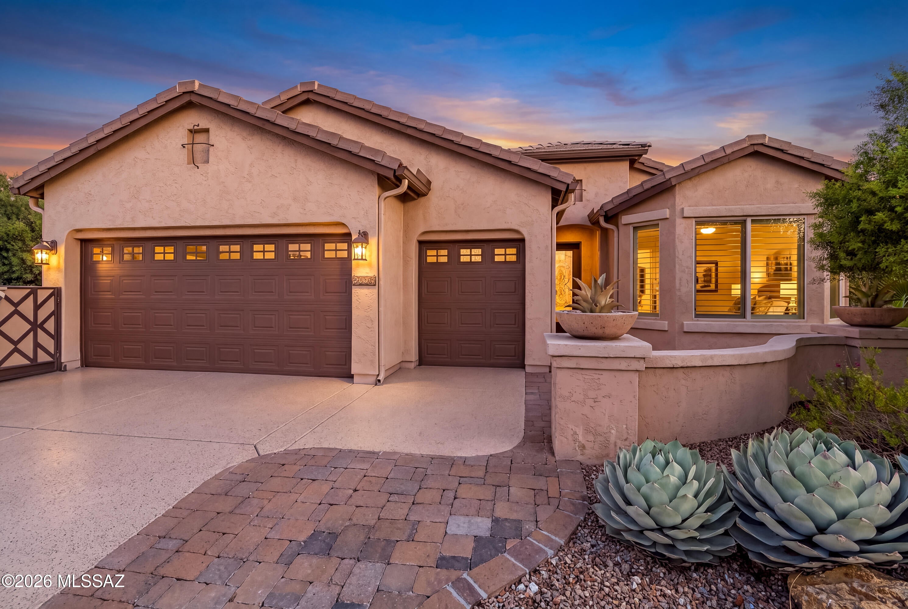 Catalina Mountain views, State Land behind you, and exceptional outdoor living define this beautifully upgraded Dolce at SaddleBrooke Ranch. The private, fully fenced backyard enjoys an open desert backdrop with direct access to the adjacent nature trail, creating a wonderful sense of space and privacy. An expansive covered and screened patio, generous entertaining area, fire pit, and recently added hot tub with dedicated electrical and paver base create an inviting setting for taking in the mountain views and Arizona sunsets.

Inside, this lightly lived-in home offers thoughtful upgrades throughout, including bay window extensions, plantation shutters, beautiful alder cabinetry with roll-out shelving, and new carpet throughout in April 2026. Custom built-ins enhance both the great room and den, providing attractive and functional spaces for entertainment and a home office. The kitchen features newer appliances, while the well-appointed baths feature ceramic tile surrounds.

The extended garage is another standout, offering a dedicated golf cart bay, extensive custom cabinetry, overhead storage, and a coated floor. Additional improvements include a newer hot water heater, upgraded HVAC system, electrical upgrades, additional pavers, and updated irrigation.

Enjoy a premier SaddleBrooke Ranch location where peaceful desert surroundings meet resort-style living, with golf, pickleball, tennis, fitness, indoor and outdoor pools, dining, clubs, and countless opportunities to enjoy the active Arizona lifestyle. A special combination of mountain views, privacy, extensive upgrades, and outdoor living that's increasingly hard to find.